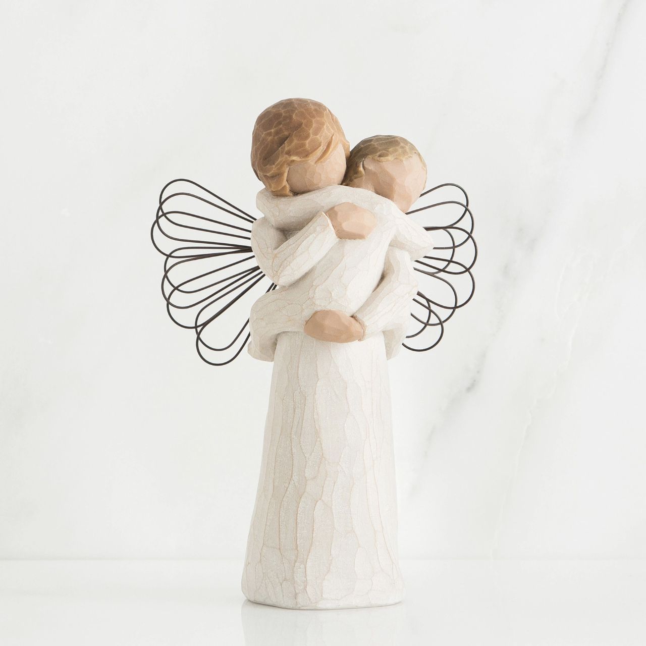 Angel's Embrace by Willow Tree Willow Tree is an intimate line of figurative sculptures representing sentiments of love, closeness, healing, courage, hope...all the emotions we encounter in life. "This piece can be about the feeling you get from holding a child, or the child can represent something you want to protect... a person, a memory, a relationship, a dream, a belief..." - Susan Lordi.