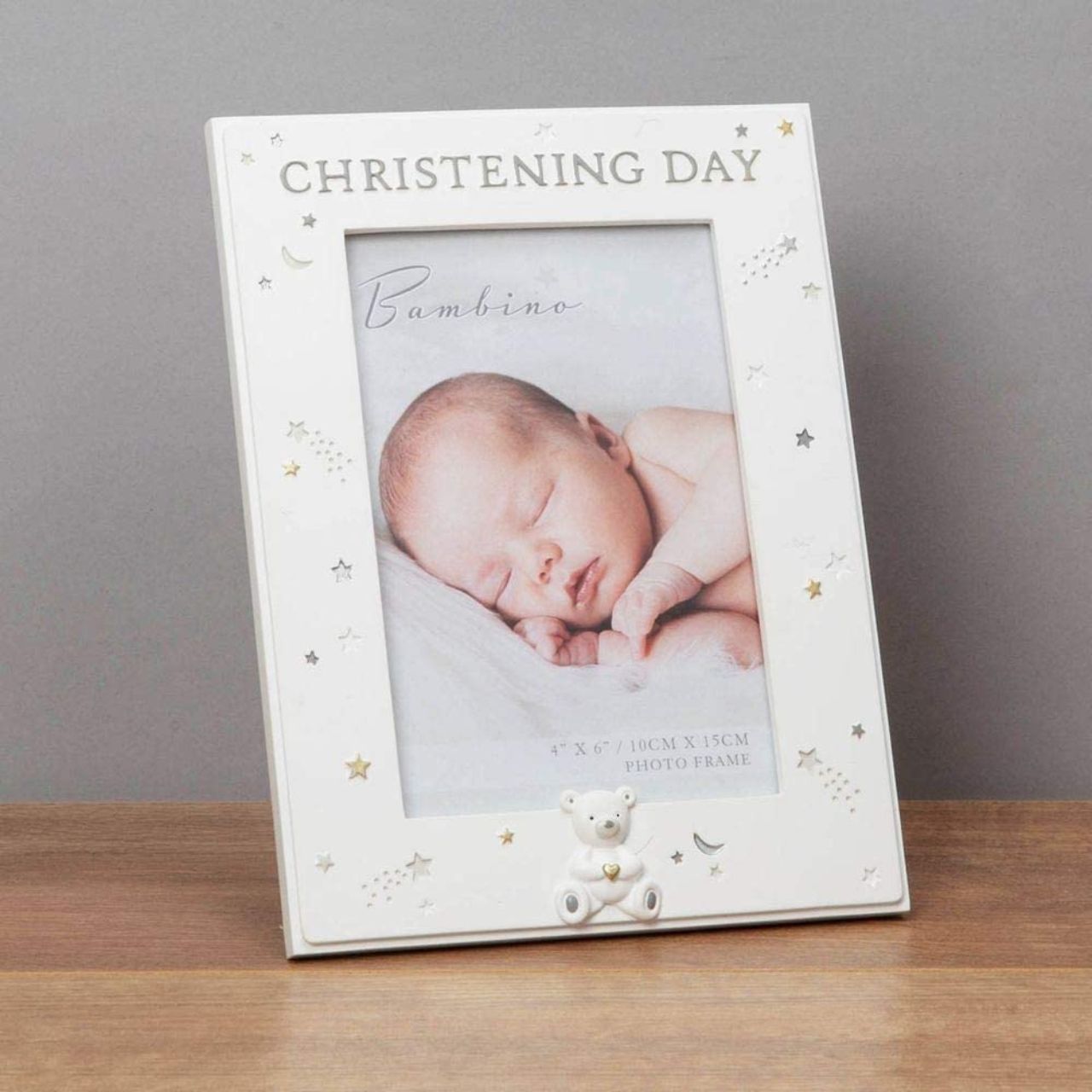 Bambino Resin Christening Day Photo Frame 4" x 6" Celebrate your beautiful new addition with this 6" x 4" 'Christening Day' photo frame. From BAMBINO BY JULIAN - a timeless collection to suit the dedication of a new-born's future to faith and morality.