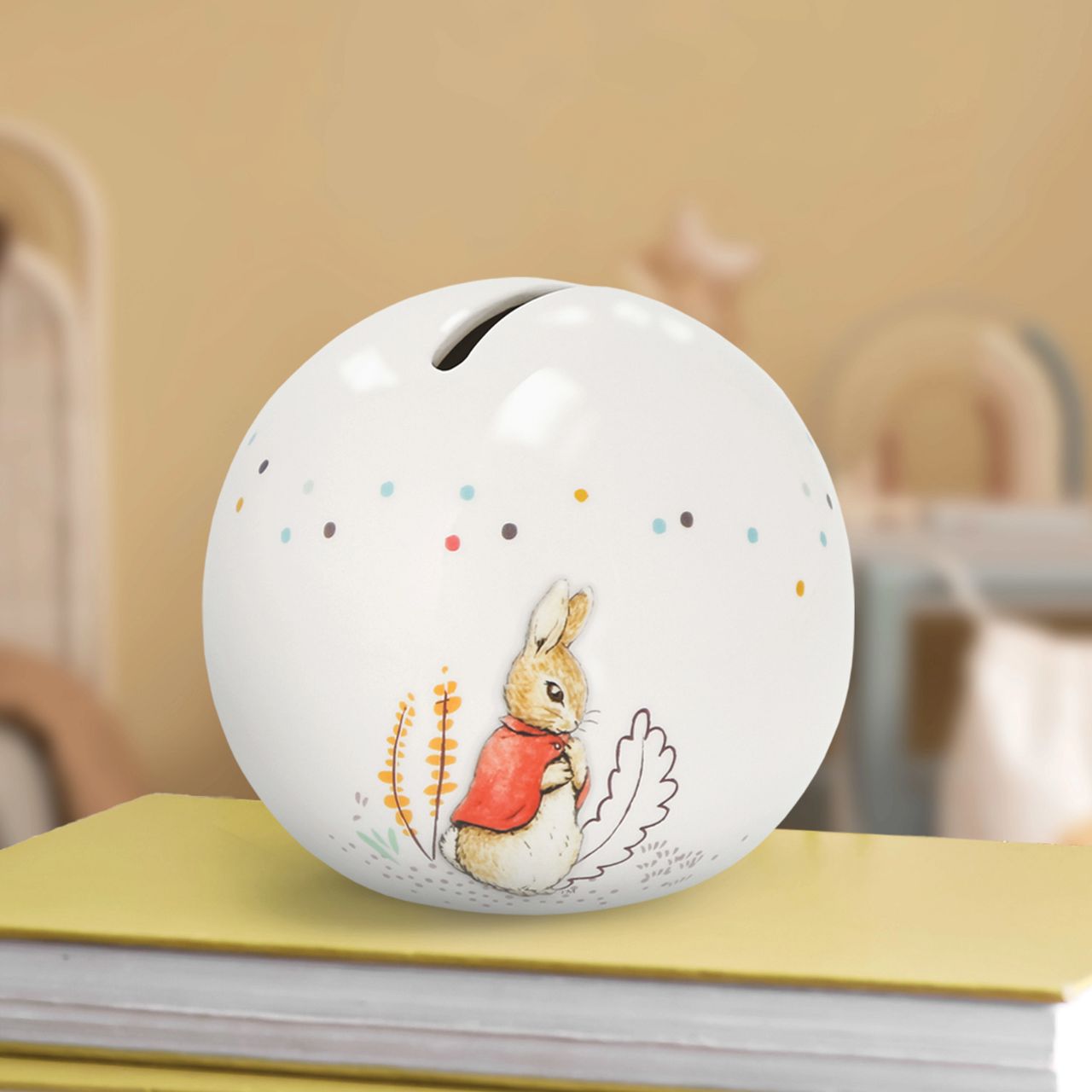 Delight your customers with our exquisite Flopsy bunny Money Bank, a must-have addition for any retail collection featuring beloved literary classics. Crafted from high-quality materials, this charming piece showcases beautifully embossed character artwork, bringing Beatrix Potter's iconic illustrations to life with intricate detail and vibrant colour.
