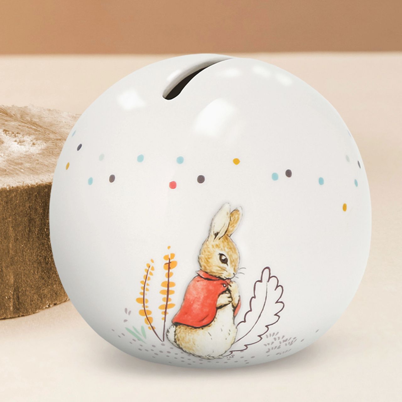 Delight your customers with our exquisite Flopsy bunny Money Bank, a must-have addition for any retail collection featuring beloved literary classics. Crafted from high-quality materials, this charming piece showcases beautifully embossed character artwork, bringing Beatrix Potter's iconic illustrations to life with intricate detail and vibrant colour.