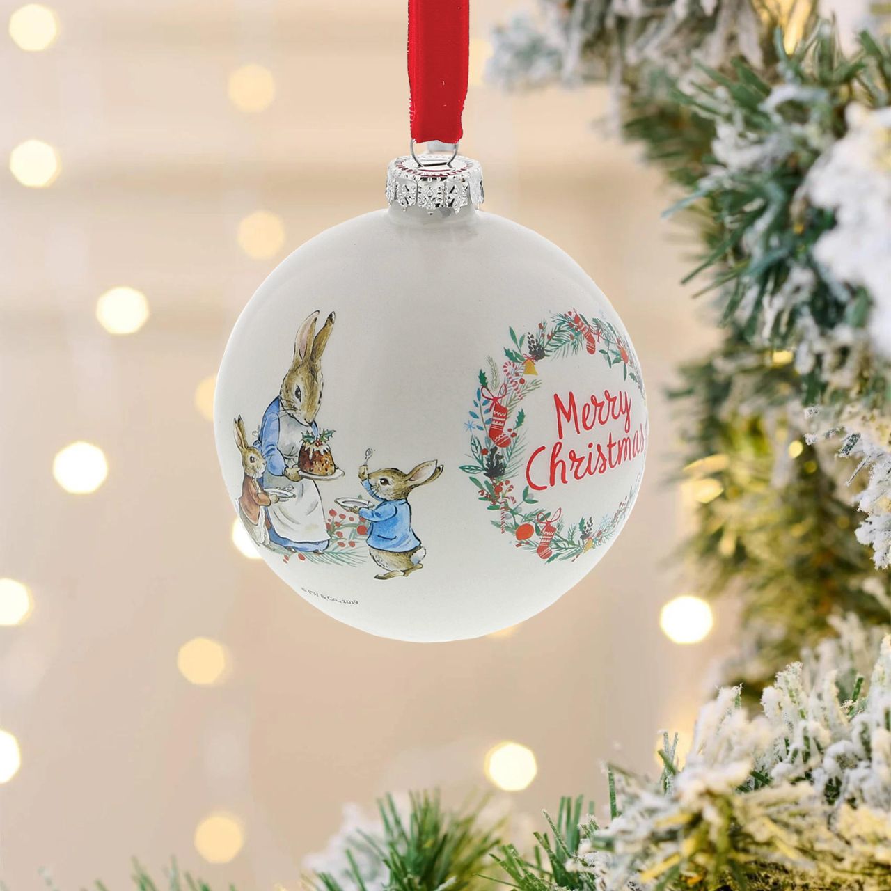 Beatrix Potter Peter Rabbit Christmas Bauble A beautiful glass Peter Rabbit Bauble that makes a treasured keepsake all year round. The artwork for each product is taken from the original illustrations from the Beatrix Potter stories, helping bring each character to life.