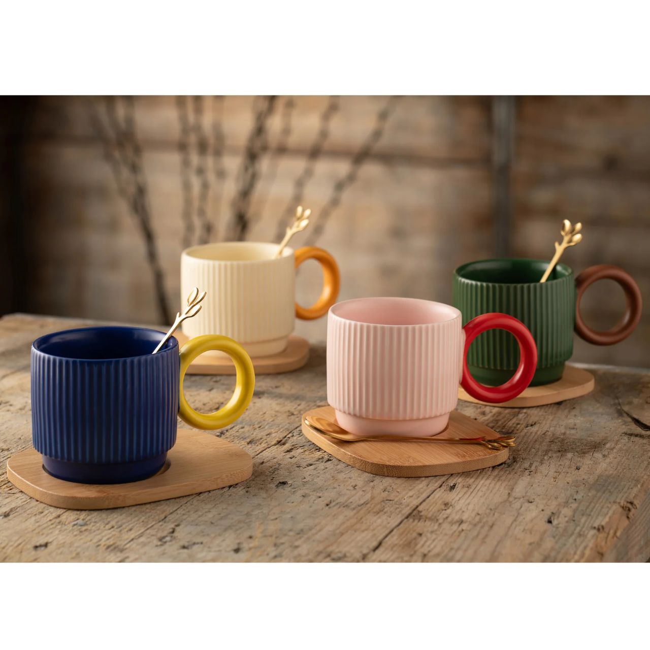 The Hula mug set feature bold, trendy shapes and an embossed fluted pattern in a playful mix and match colour palette. The Hula mugs come with a stainless steel tea spoon and a bamboo tray for each mug.