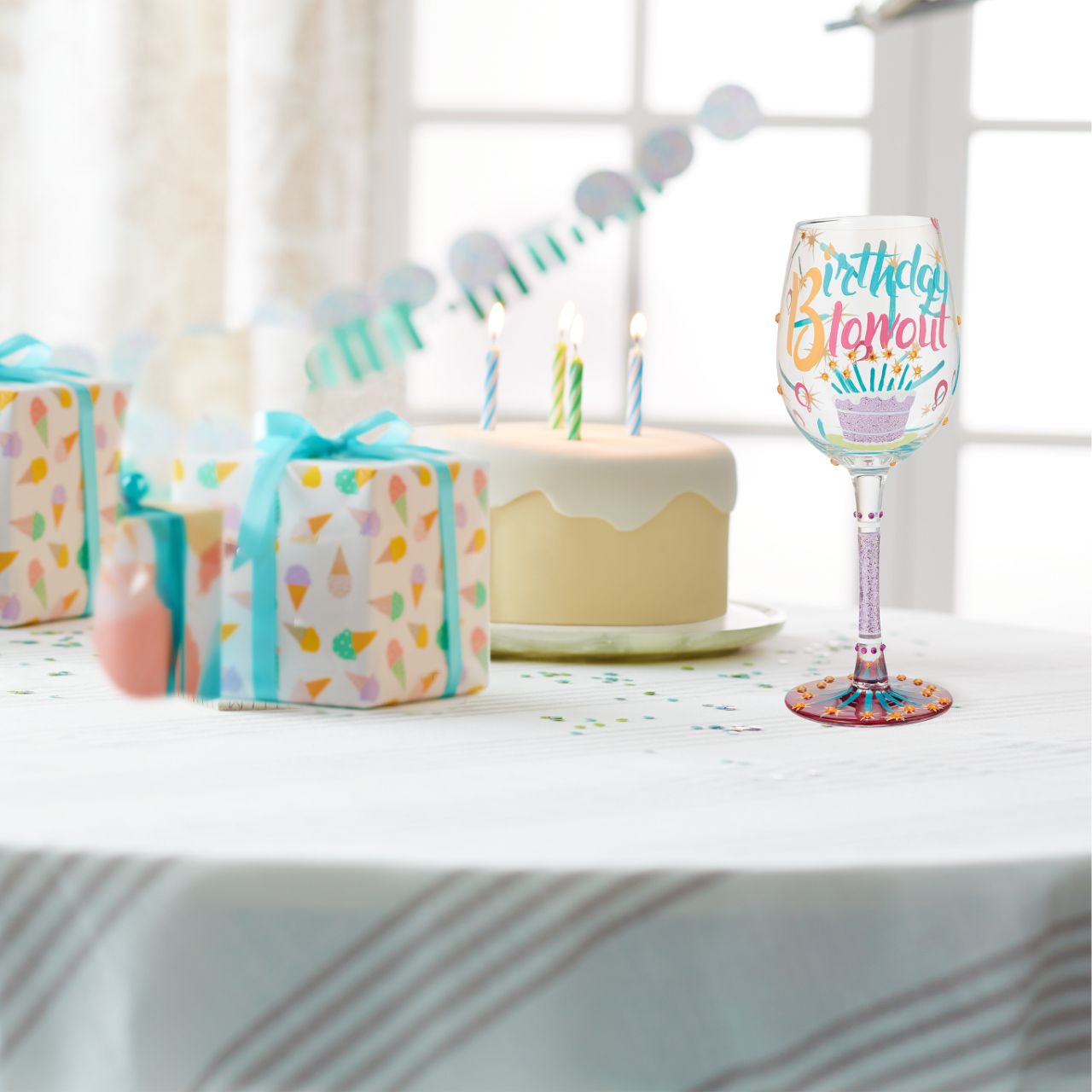 Birthdays only come once a year, make sure to milk them for all they're worth when they do. Serve every birthday beverage in this festive glass, covered in streamers, balloons, and a rainbow of gems. Let there be no doubt who's day it is.