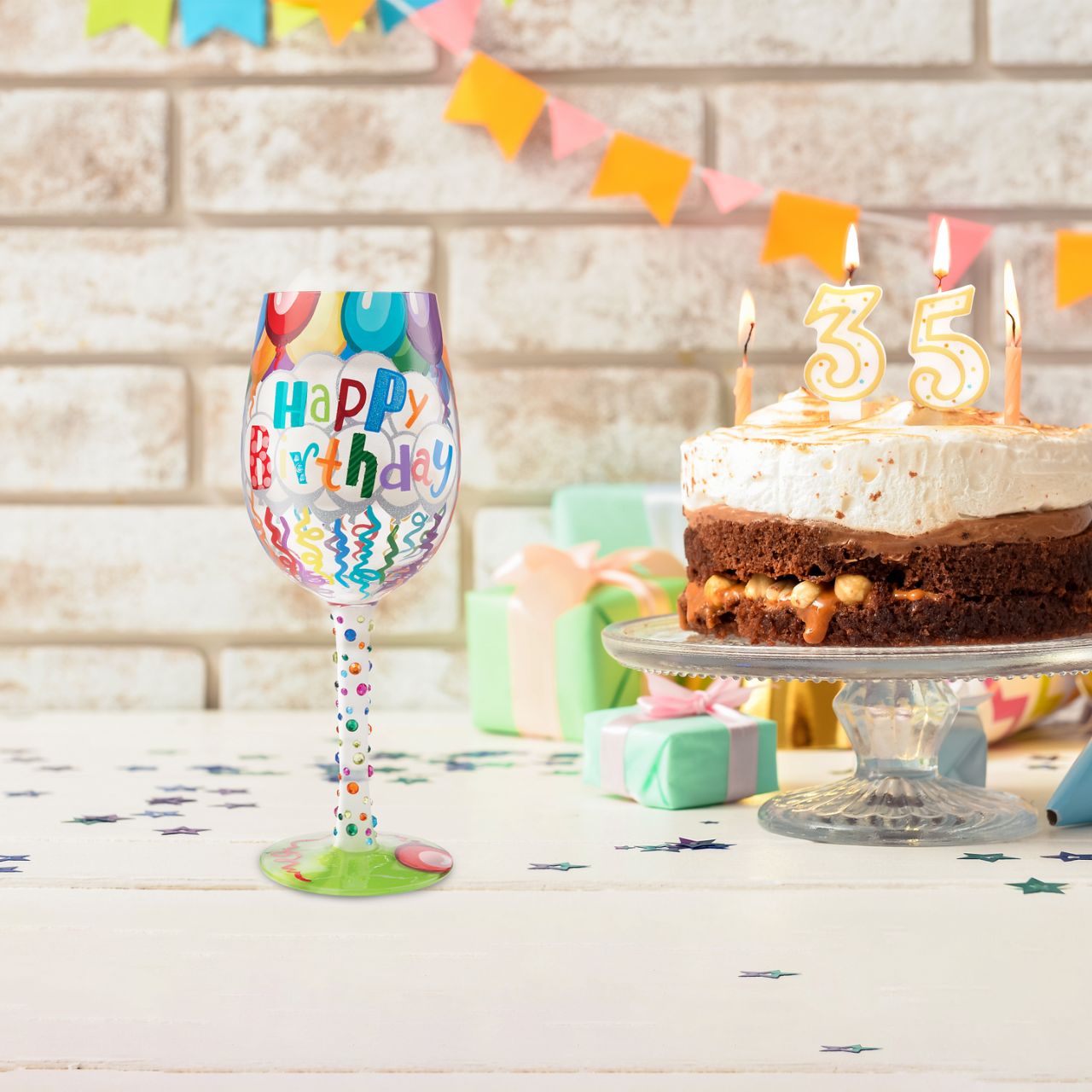 Birthdays only come once a year, make sure to milk them for all they're worth when they do. Serve every birthday beverage in this festive glass, covered in streamers, balloons, and a rainbow of gems. Let there be no doubt who's day it is.