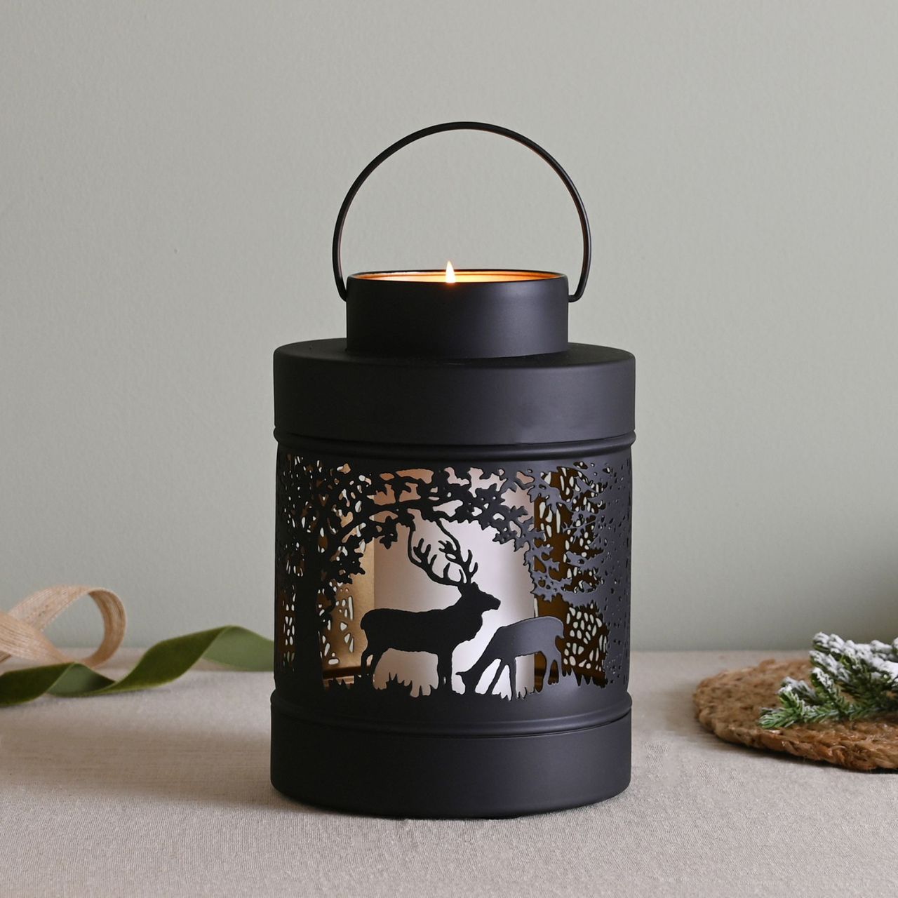 Christmas Black Forest Scene Round Lantern Medium A medium black forest scene lantern by THE SEASONAL GIFT CO. This enchanting lantern glistens with festive charm throughout the Christmas period.