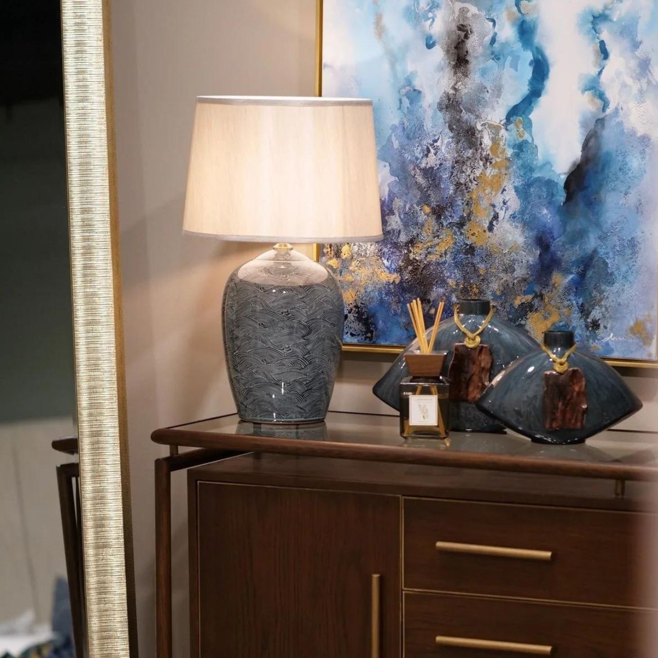 Blue Waves Lamp by Mindy Brownes Mindy Brownes Ceramic Lamp. Good lighting is essential for every home. Our ceramic collection is traditional yet timeless and featuring stunning designs, prints and patterns bursting with colour. This lamp features blue and navy wave details with a taupe linen shade.