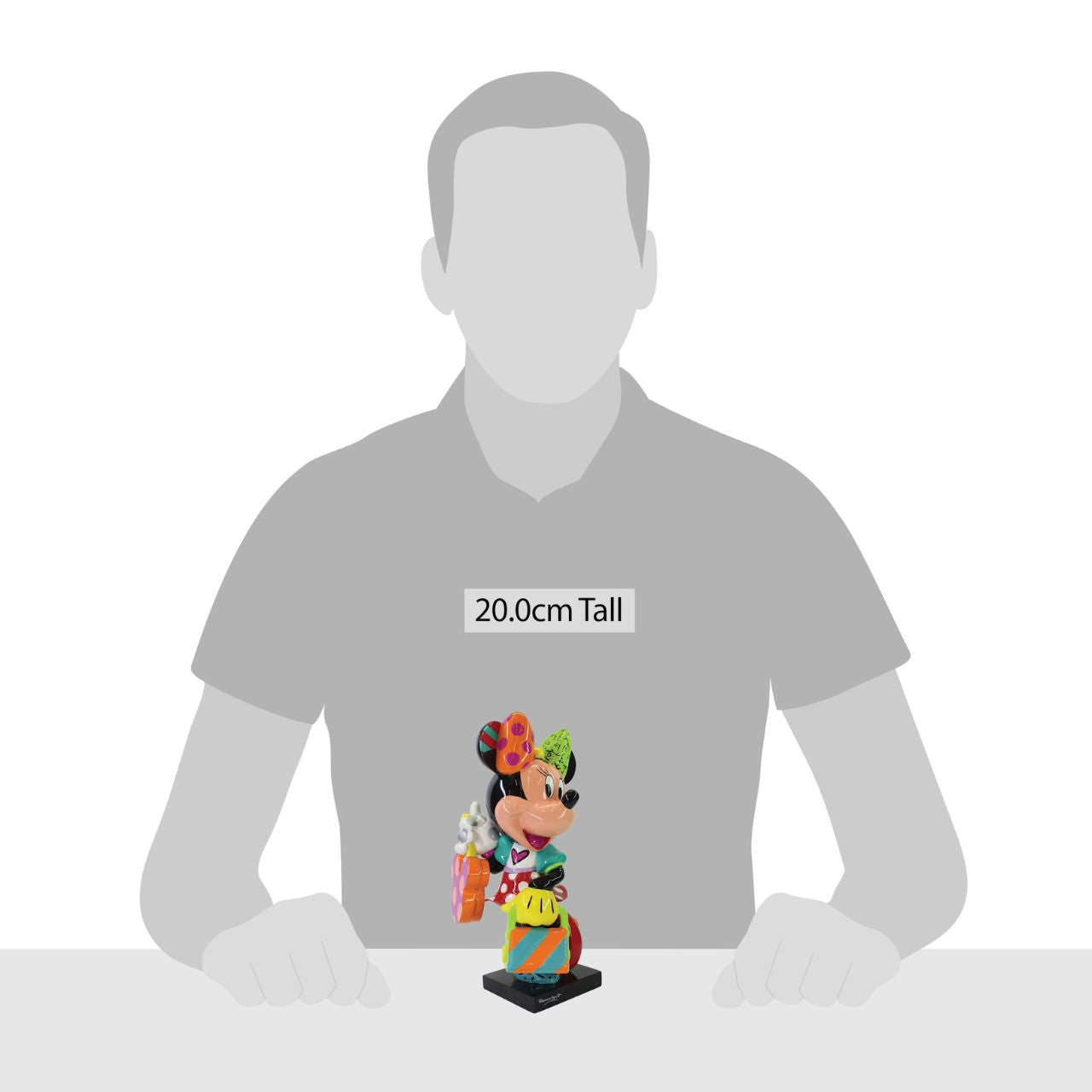 The glamorous Minnie Mouse shows off her fashion side in this colourful figurine. Made from cast stone with high-gloss shiny finish. Packed in a branded gift box. Not a toy or children's product. Intended for adults only.