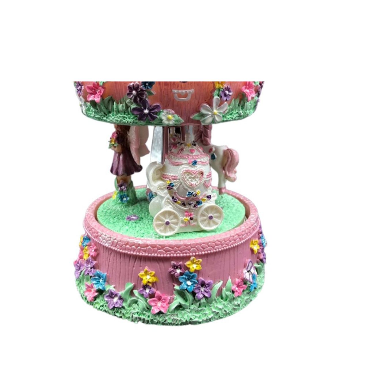 Music box Fairy Carousel. The colorful carousel, equipped with a fairy in a carriage, rotates to a melody.