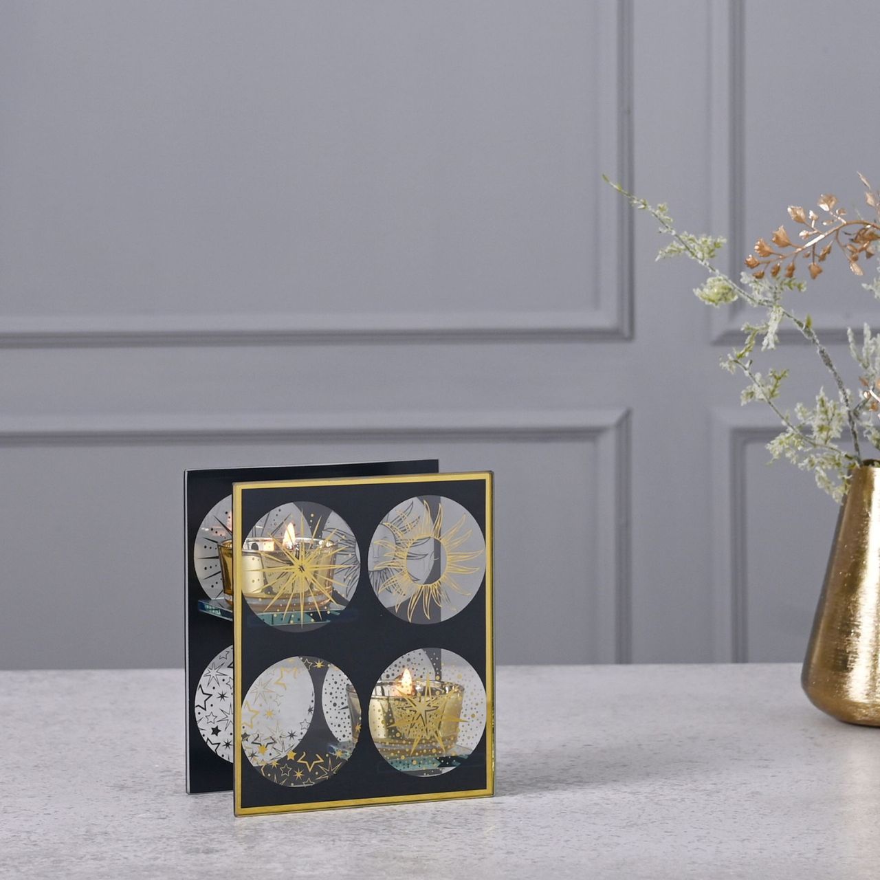 Celestial Double Tealight Holder A celestial single glass tea light holder by THE SEASONAL GIFT CO. This celestial tea light holder takes inspiration from the stars as it shines brightly for all to admire.
