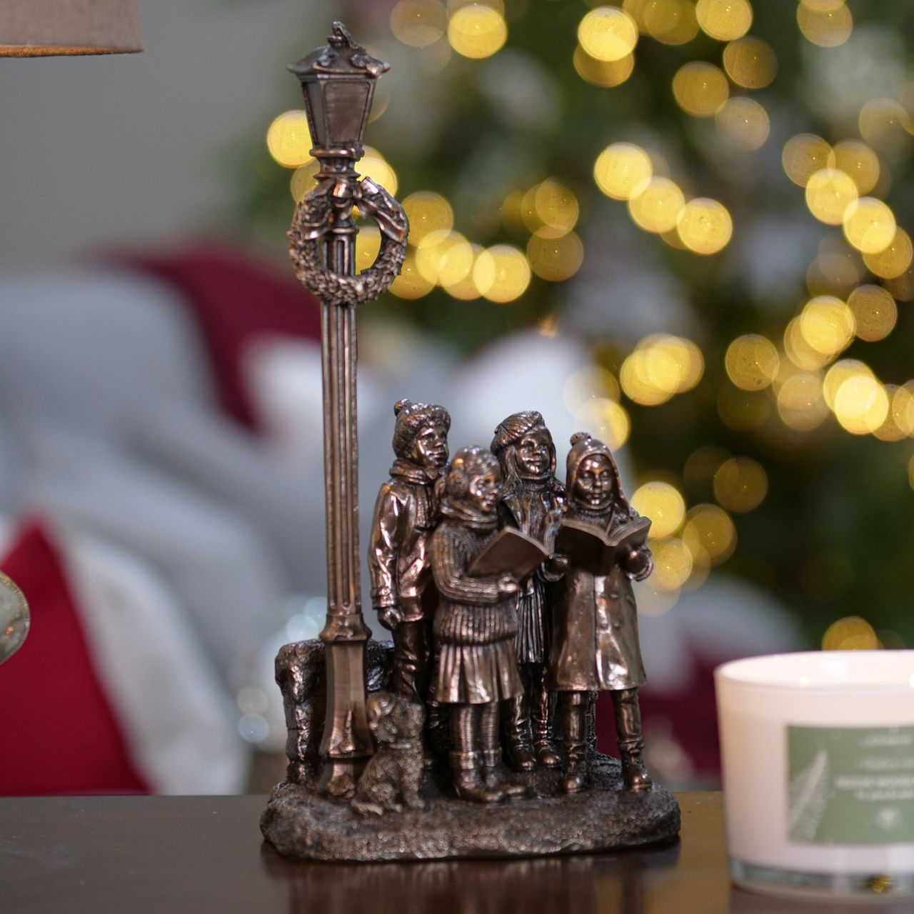 Genesis Ireland Christmas Carol Singers A stunning ornament that is sure to bring festive cheer to your home. A beautiful bronze coloured Christmas decoration, by Genesis Ireland. Depicting a group of carol singers spreading the joy of Christmas. Let the magic of Christmas fill your home with this gorgeous sculpture for many years to come.
