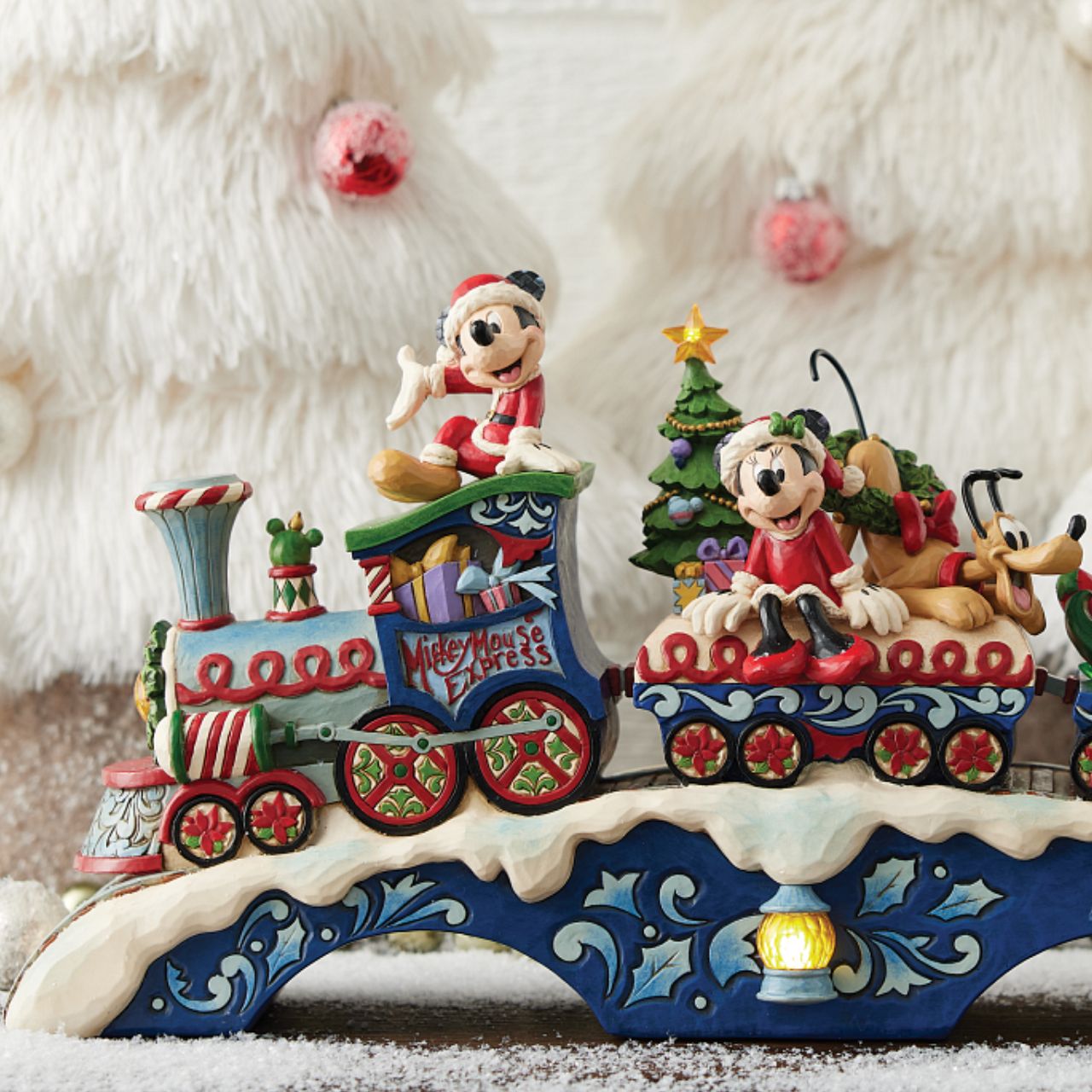 This fantastic Jim Shore Mickey Mouse Express chugs along a snowy track, bringing festive cheer as it lights up and plays eight beloved Christmas tunes. With intricate details, the train showcases Mickey and his friends, trees, gifts, and lights.
