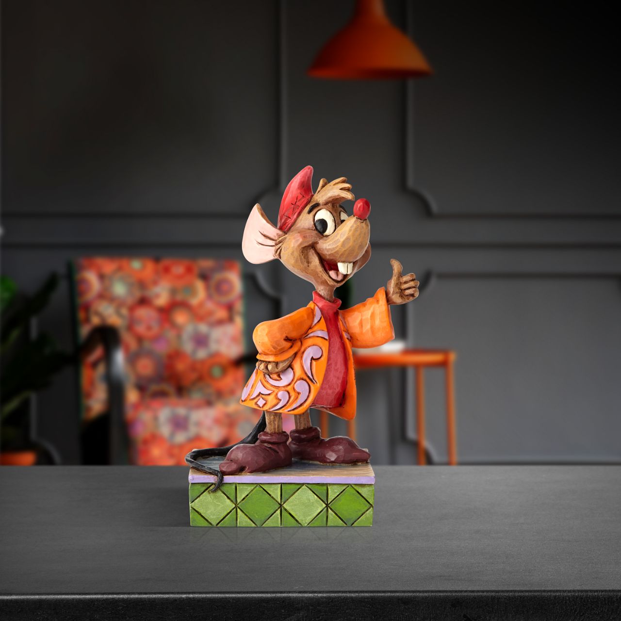 Cinderella's number one sidekick is kind, brave and fiercely loyal. This handcrafted design showcases Jaq's optimistic spirit, as the grinning mouse extends an eager thumbs-up. His trademark orange jacket has been reimagined with lavender flowers.