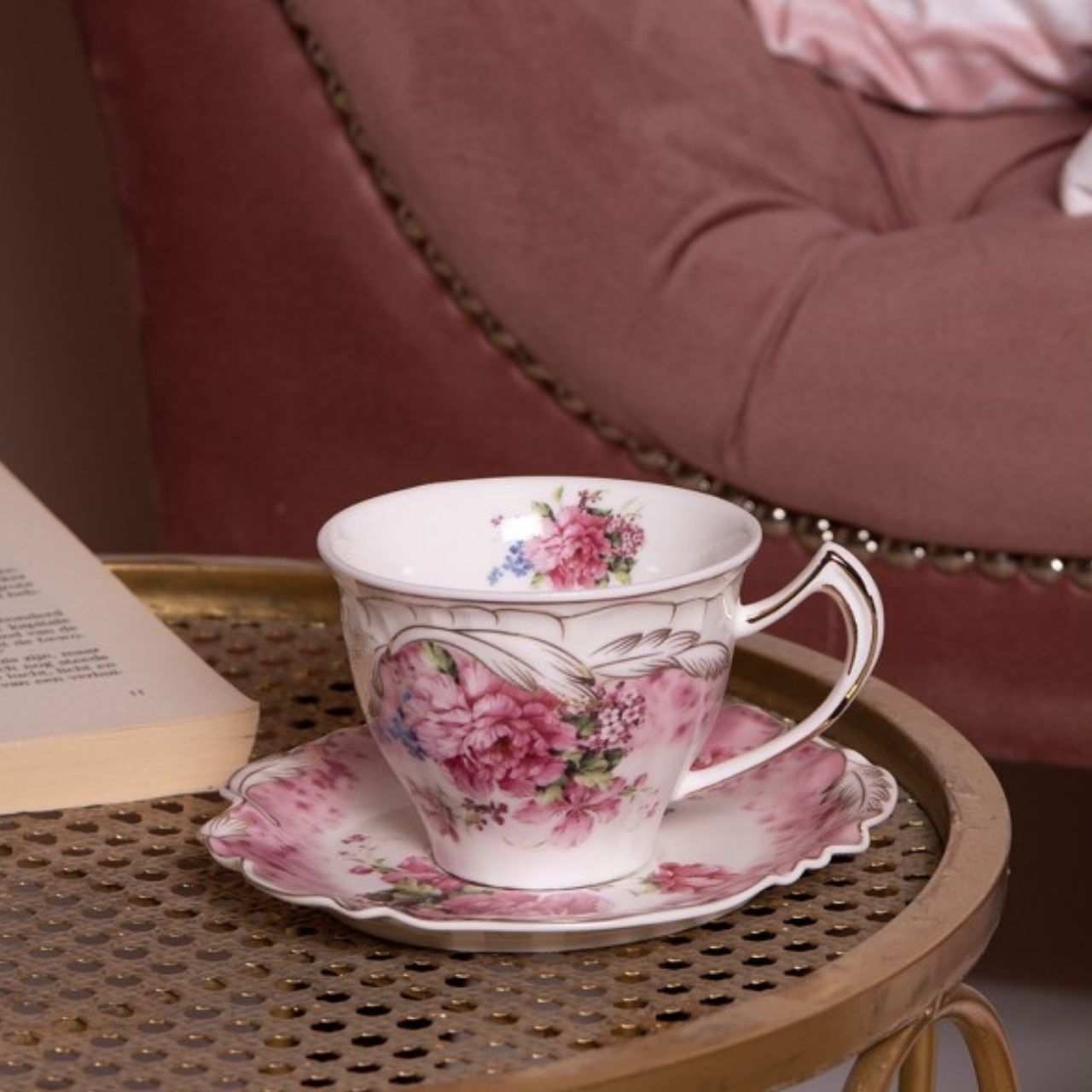 Enjoy a special cup of tea or coffee with the Clayre & Eef Classic Pink Flowers Cup and Saucer. Carefully crafted from quality materials, this unique cup and saucer combination is decorated with charming pink and white floral motifs for a timeless, traditional look. Whether you're hosting guests or sipping a cup of tea solo, let the Classic Pink Flowers Cup and Saucer be your tasteful choice.