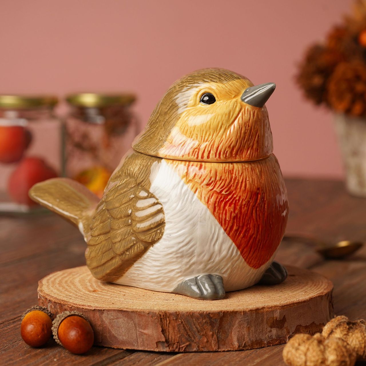This ceramic jar features a colourful robin figurine with removable lid. An eye-catching piece, perfect for storing dry goods or treats.