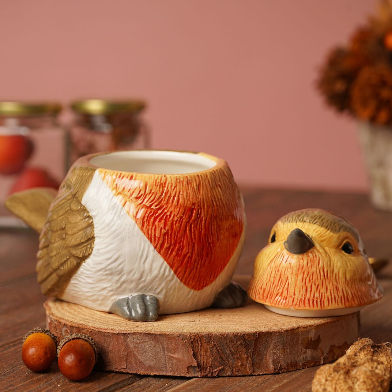 This ceramic jar features a colourful robin figurine with removable lid. An eye-catching piece, perfect for storing dry goods or treats.