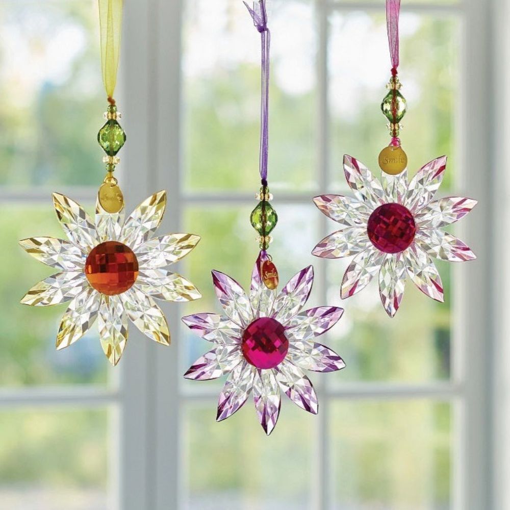 Suncatcher Acrylic Daisy Hanging Ornament Pink  Hung on a colour matching organza ribbon, this colourful Daisy is the perfect gift for a loved one. Comes with a poem tag and token attached. Can be displayed with others from the acrylic collection.