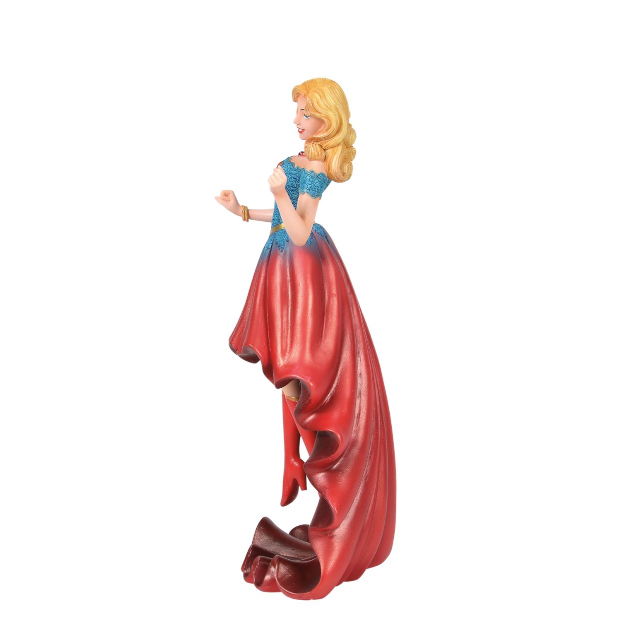 Fierce meets fabulous in this meticulously reimagined hand-crafted figure inspired by DC Comics most iconic heroines and villains. Shimmering with metallic paint accents on her flowing stylish skirt, Supergirl is mid-flight ready to conquer the world.