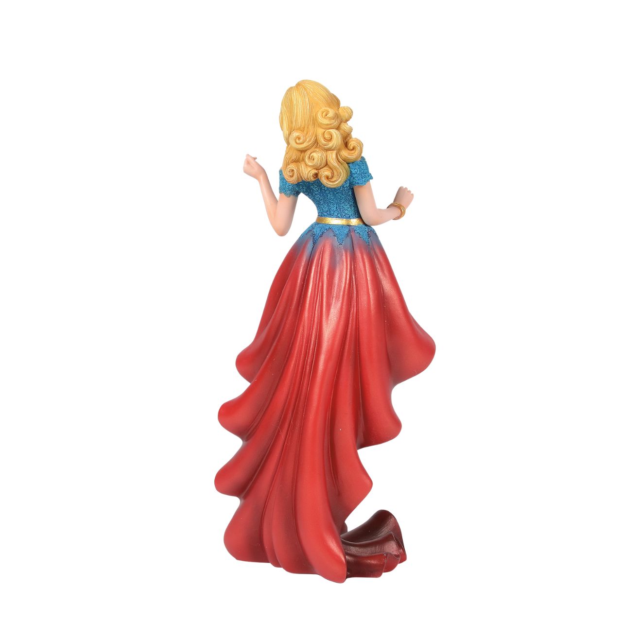 Fierce meets fabulous in this meticulously reimagined hand-crafted figure inspired by DC Comics most iconic heroines and villains. Shimmering with metallic paint accents on her flowing stylish skirt, Supergirl is mid-flight ready to conquer the world.
