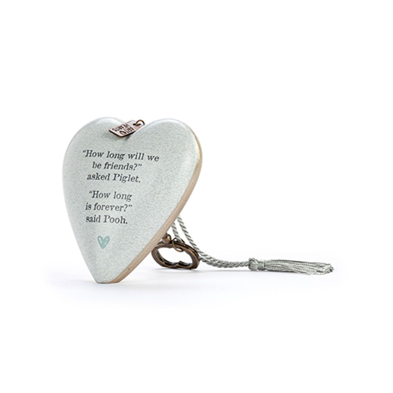 This heart-shaped ornament features a quote from Winnie the Pooh and Piglet about friendship's enduring power. Its simple yet striking design makes it a lovely gift for a treasured friend or loved one.