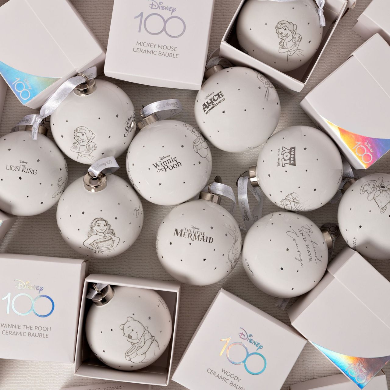 Disney 100th Anniversary Bauble - Alice An Alice bauble from Disney 100 by DISNEY. This limited edition tree decoration captures the true magic of Disney on its centenary and can be enjoyed by fans of all ages at Christmas.