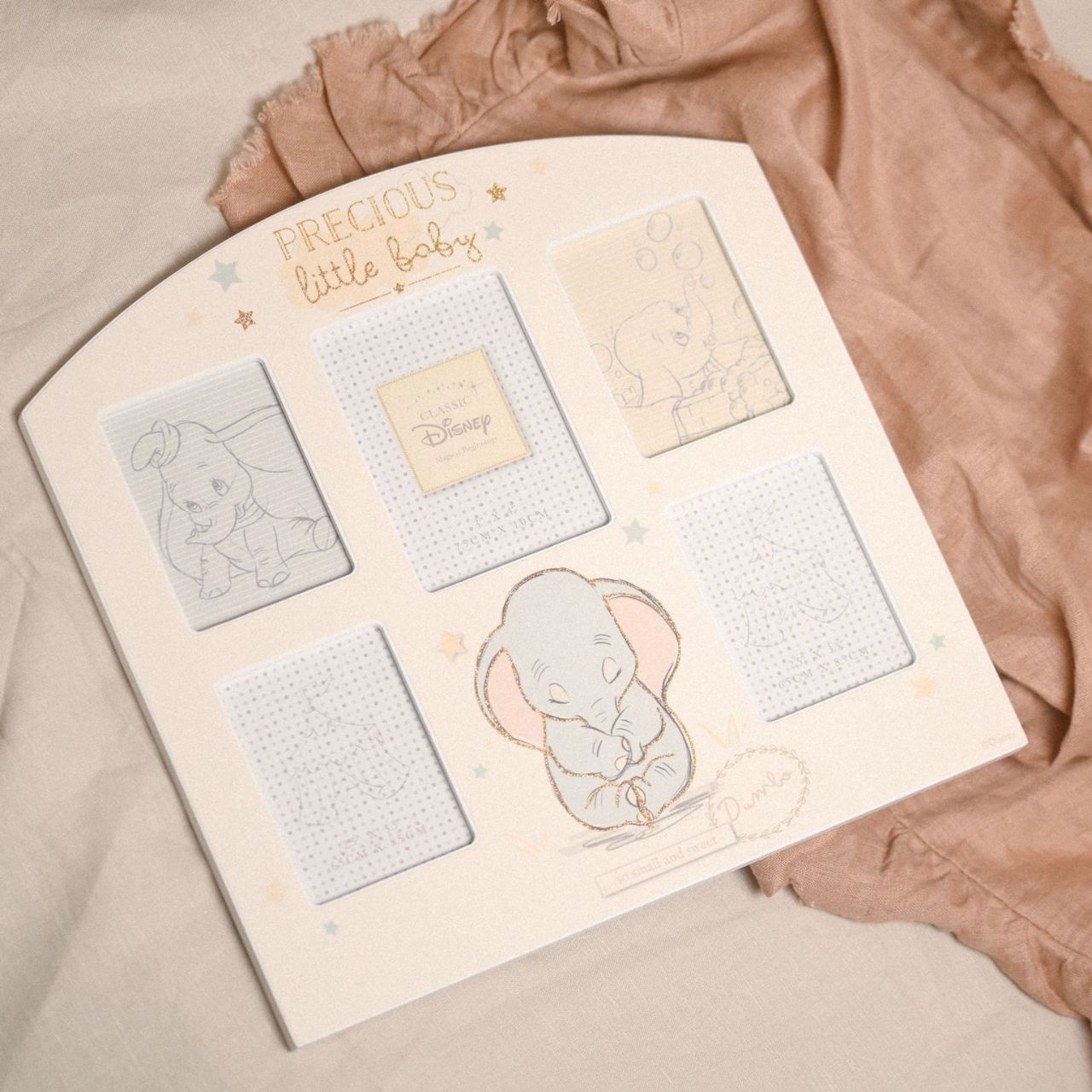 Disney Magical Beginnings Arch Collage Frame - Dumbo This heart-warming collage frame from Magical Beginnings adds a touch of Disney magic to the home and perfectly captures the precious memories of a family’s new arrival.