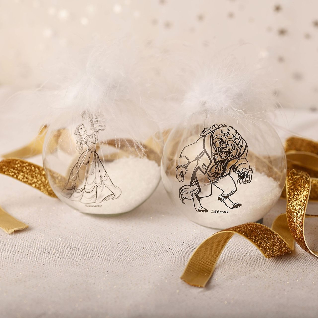 Disney Set of 2 Belle & Beast Feather Baubles An ideal Christmas tree decoration for any Disney fanatics, this set of 2 Beauty and the Beast themed feather baubles would be an amazing gift idea this holiday season.