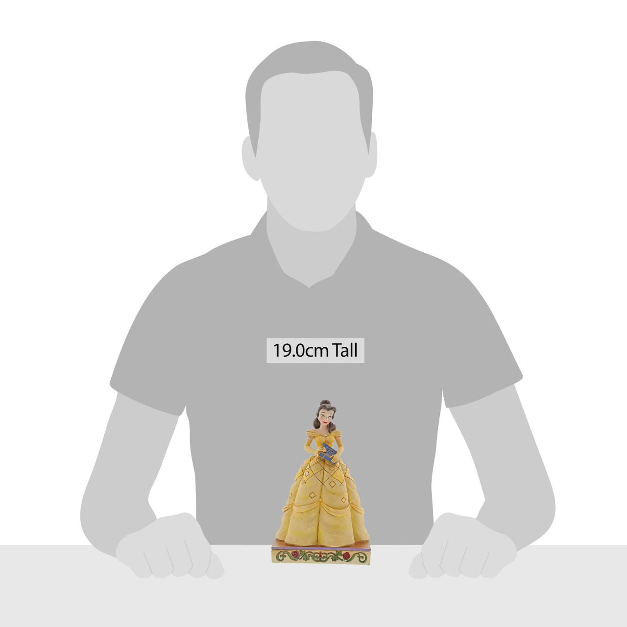 Disney Traditions Book-Smart Beauty Belle Princess Passion Belle always has her nose in a book, filling her imagination with adventure. The book-smart beauty begins her own timeless tale when she meets the Beast. In this lovely Jim Shore design, Belle wears her classic yellow gown and holds a book in her hands.