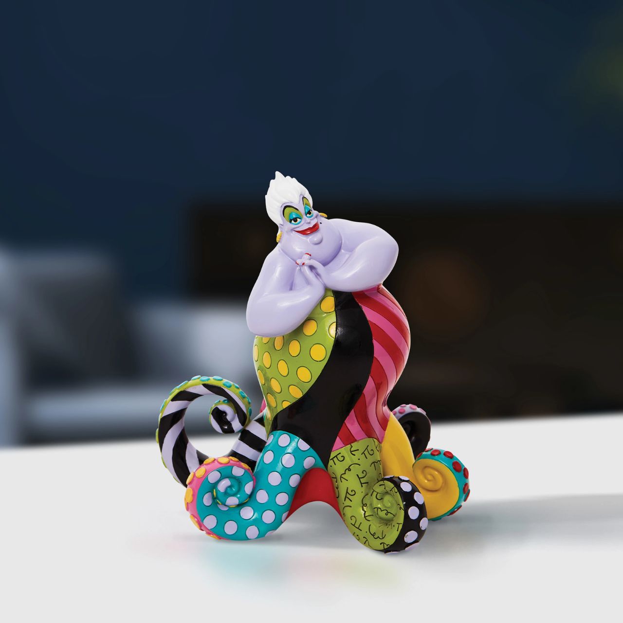 Redesigning the antagonist from The Little Mermaid, Ursula gets a chic remodel of trendy tentacles. With bold colour and compelling pattern, contemporary artist Romero Britto captures the fun and whimsy of Disney. Figurine is made from cast stone.