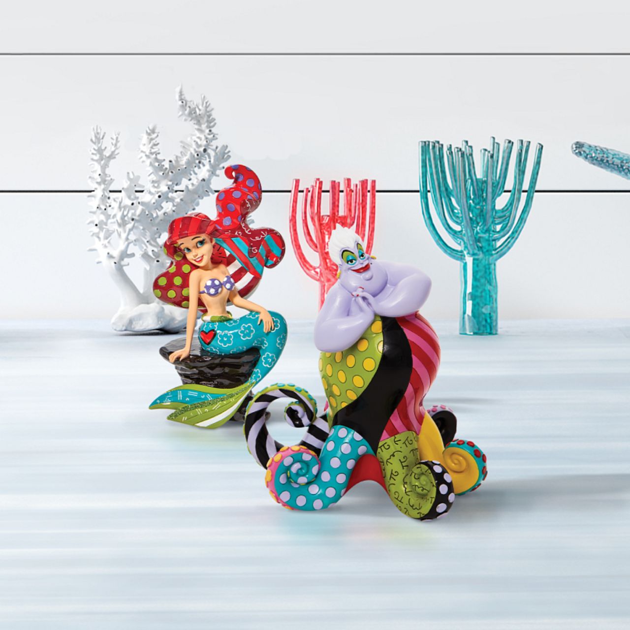 Redesigning the antagonist from The Little Mermaid, Ursula gets a chic remodel of trendy tentacles. With bold colour and compelling pattern, contemporary artist Romero Britto captures the fun and whimsy of Disney. Figurine is made from cast stone.