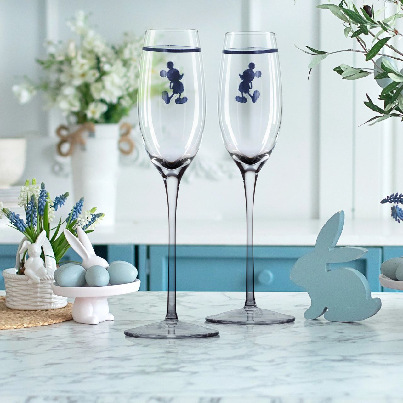 Introducing Disney silhouette Mickey Mouse Toasting Glasses - This set of two toasting glasses will elevate any celebration. With a touch of Disney magic these Toasting glasses feature the iconic and beloved silhouette of Mickey Mouse.
