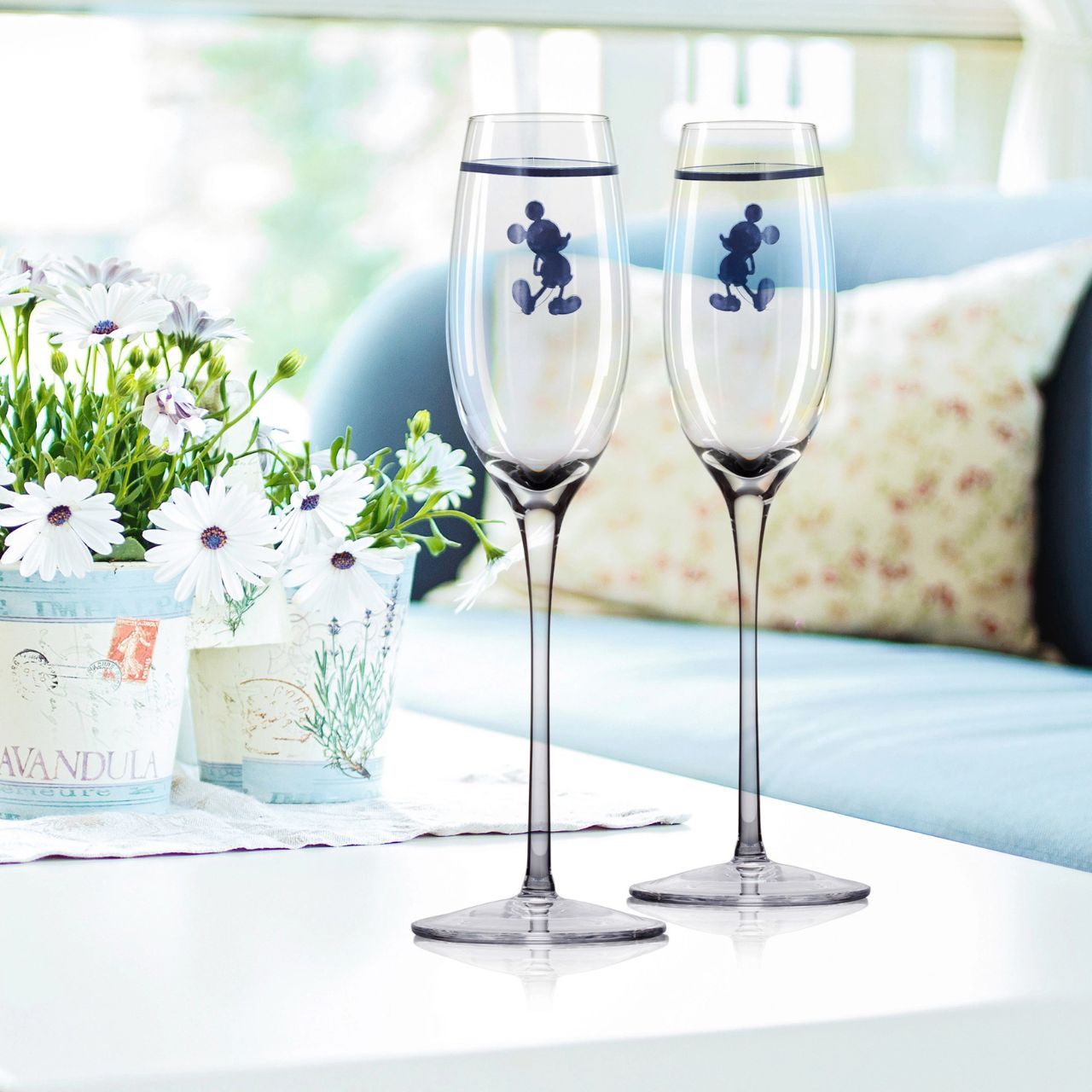 Introducing Disney silhouette Mickey Mouse Toasting Glasses - This set of two toasting glasses will elevate any celebration. With a touch of Disney magic these Toasting glasses feature the iconic and beloved silhouette of Mickey Mouse.