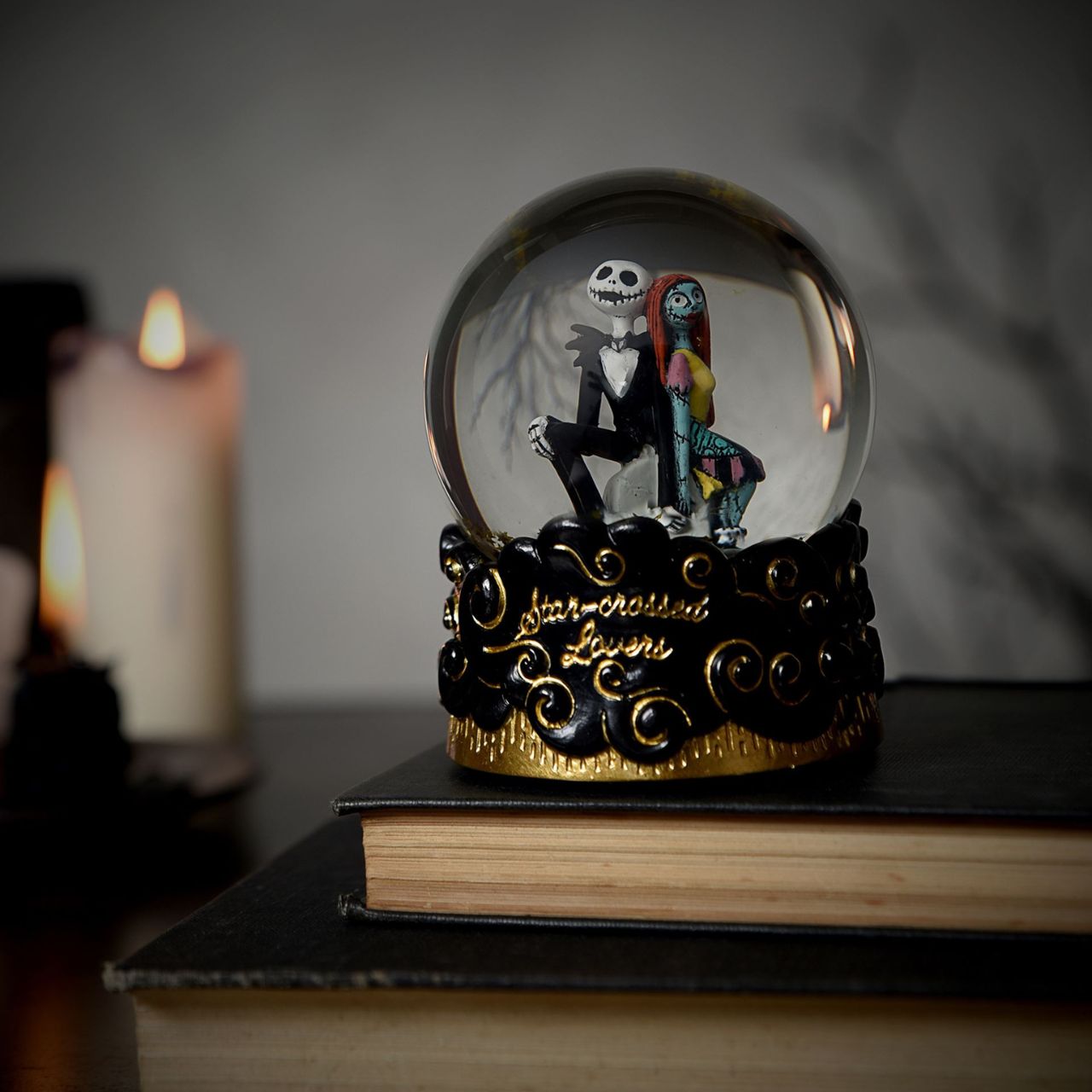 Step into the whimsical world of The Nightmare Before Christmas with this enchanting snow globe featuring Jack Skellington and Sally. Watch as the snow swirls around them, capturing the magic and charm of this classic Disney film.