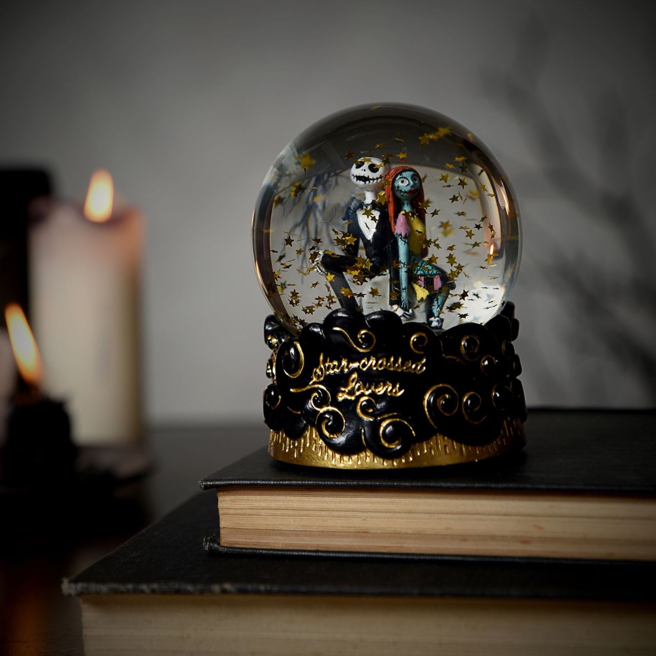 Step into the whimsical world of The Nightmare Before Christmas with this enchanting snow globe featuring Jack Skellington and Sally. Watch as the snow swirls around them, capturing the magic and charm of this classic Disney film.