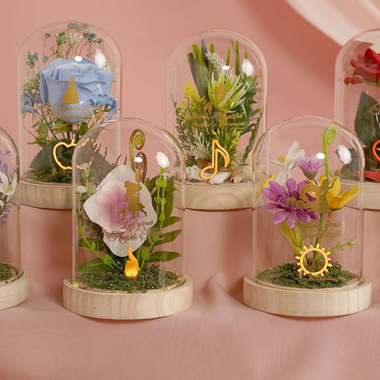 Bring the magic of Disney to the home with the Disney Pastel Princess Florals In A Cloche With Neon Light - Ariel.