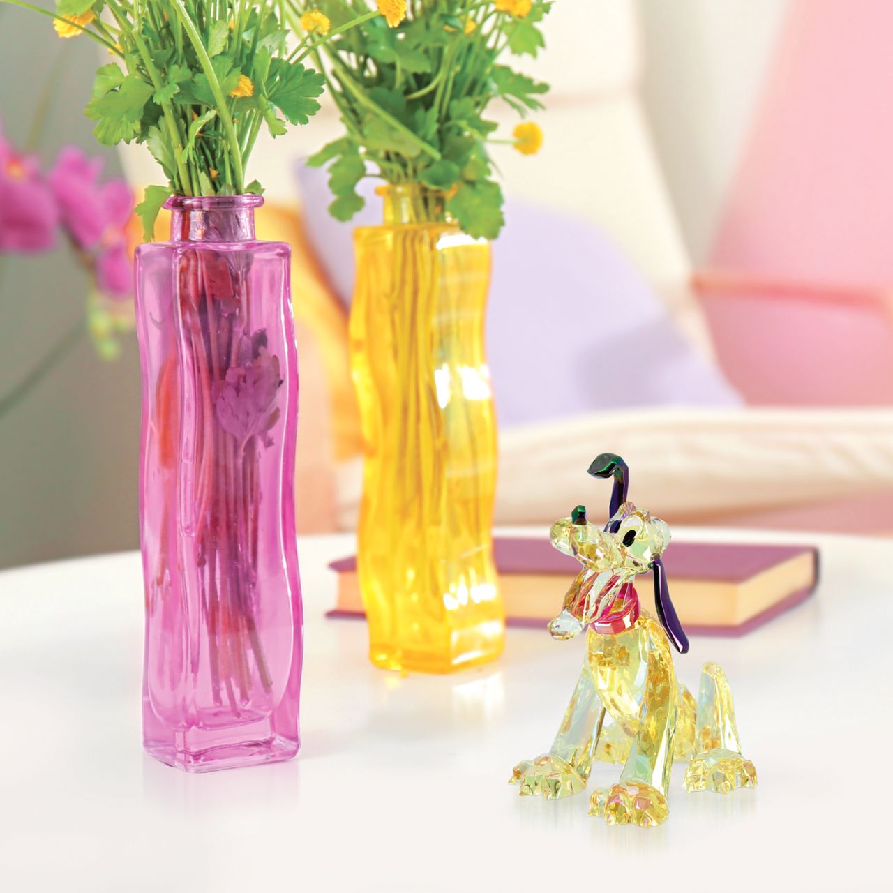 The Disney Facets Collection brings the world's most iconic and beloved characters to life in these "gem cut" acrylic sculptures. With the look of cut crystak at a fraction of the price, this electroplated Pluto catches the eye with his show-stopping sparkles.