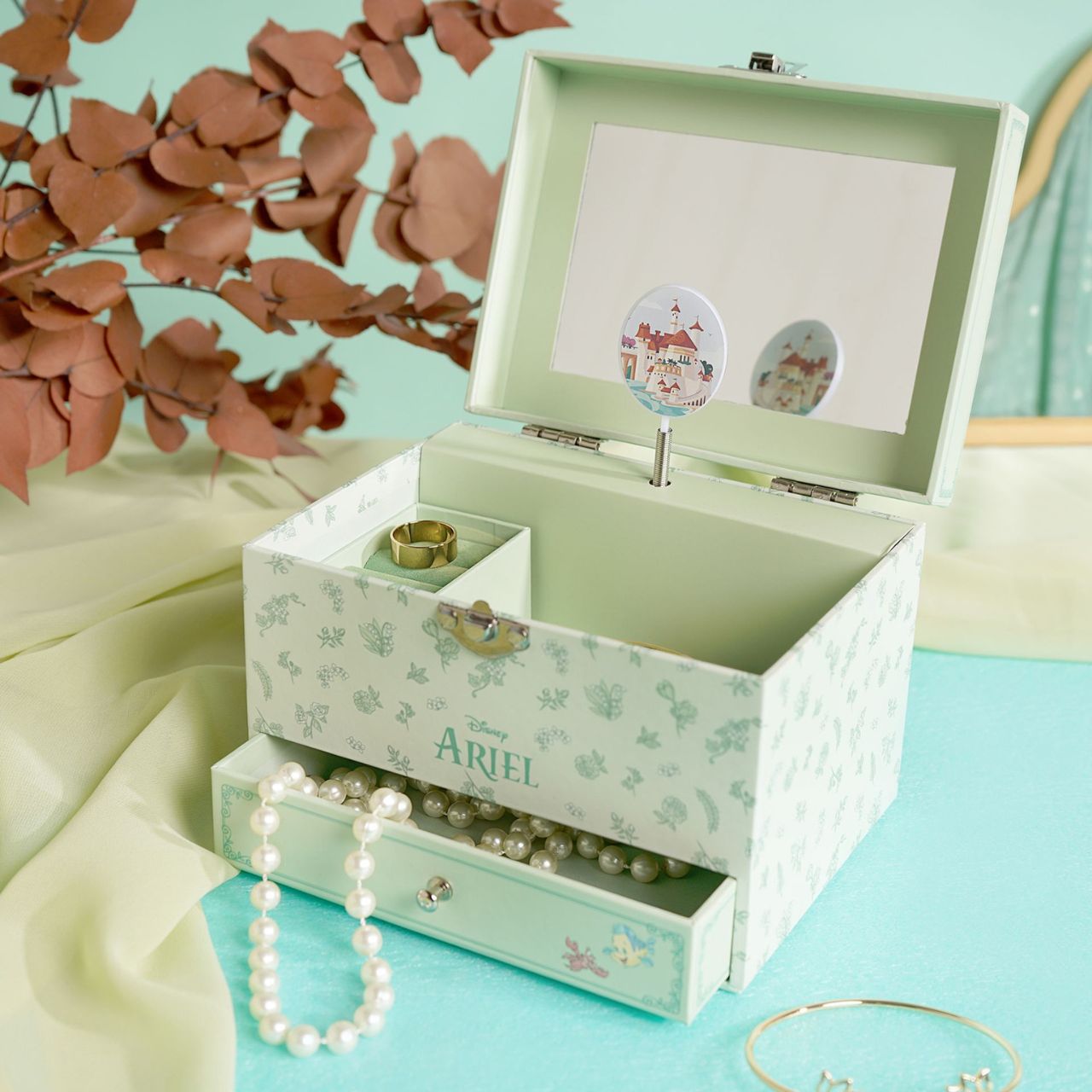 This enchanting jewellery box, adorned with a floral pattern, is a perfect spot for storing treasured trinkets. With a drawer for small keepsakes and a cheery tune that plays when opened, its an ideal gift for Disney princess enthusiasts of all ages.