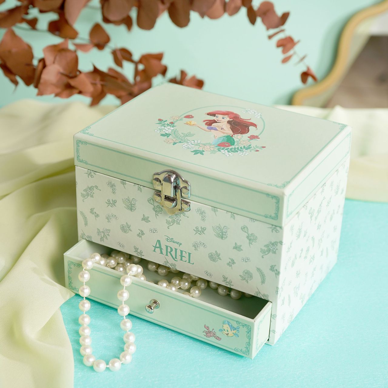 This enchanting jewellery box, adorned with a floral pattern, is a perfect spot for storing treasured trinkets. With a drawer for small keepsakes and a cheery tune that plays when opened, its an ideal gift for Disney princess enthusiasts of all ages.