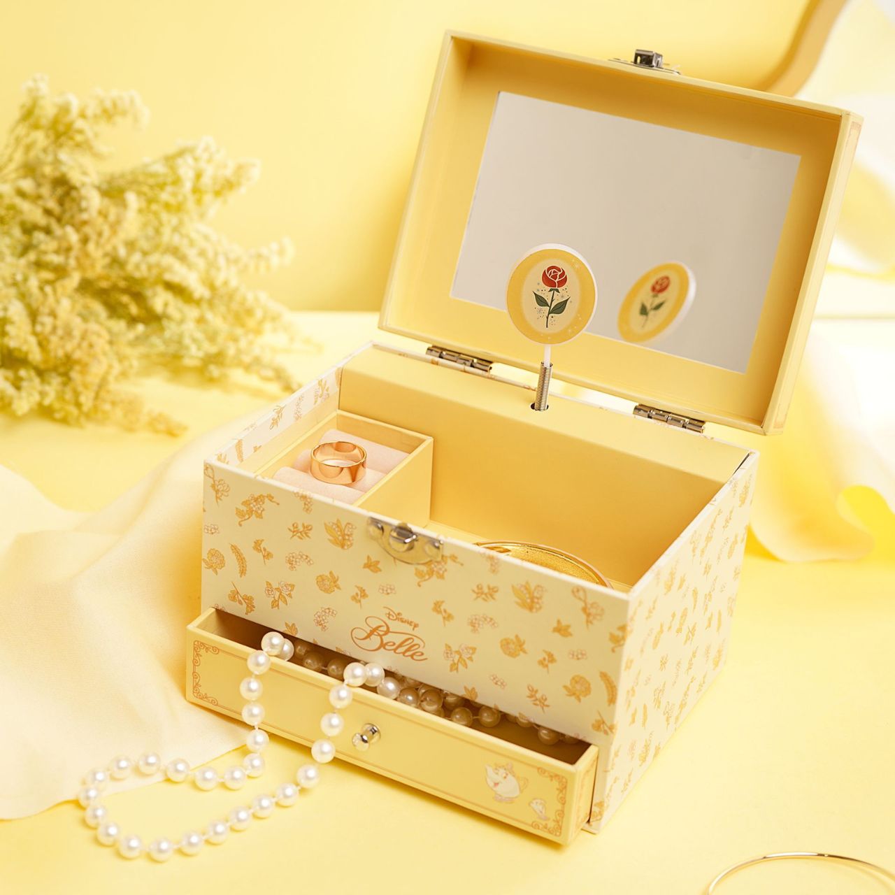 This enchanting jewellery box, adorned with a floral pattern, is a perfect spot for storing treasured trinkets. With a drawer for small keepsakes and a cheery tune that plays when opened, its an ideal gift for Disney princess enthusiasts of all ages.
