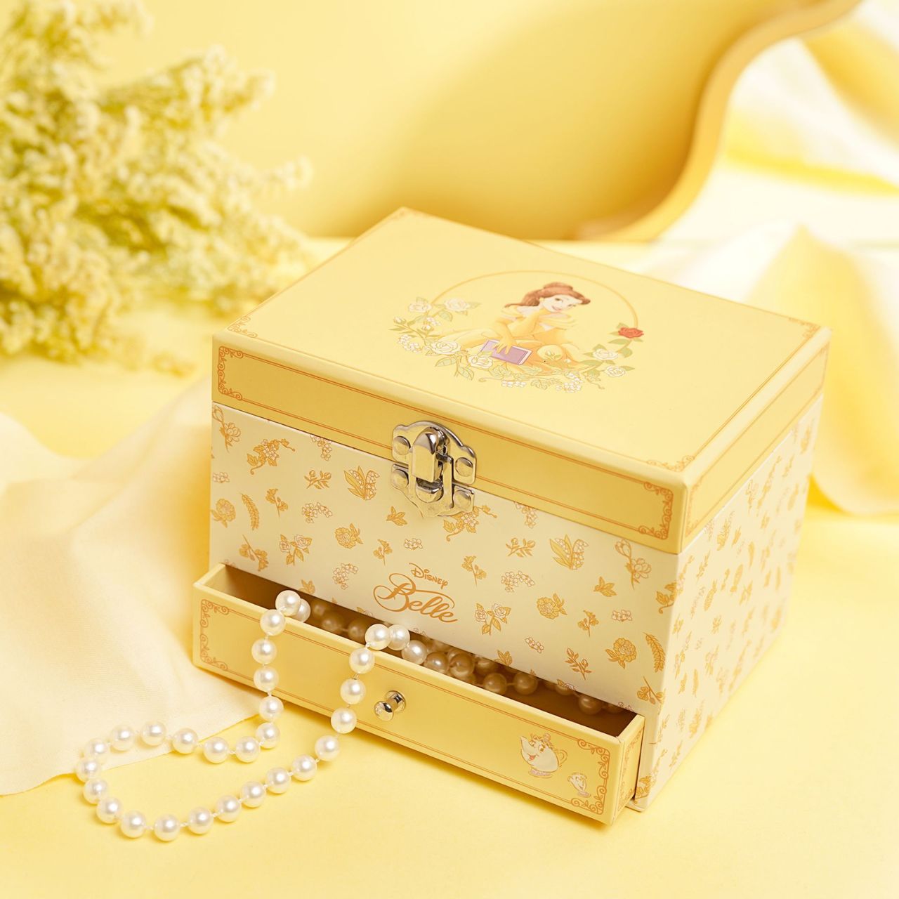 This enchanting jewellery box, adorned with a floral pattern, is a perfect spot for storing treasured trinkets. With a drawer for small keepsakes and a cheery tune that plays when opened, its an ideal gift for Disney princess enthusiasts of all ages.
