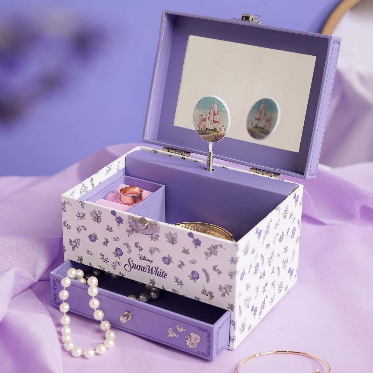 This enchanting jewellery box, adorned with a floral pattern, is a perfect spot for storing treasured trinkets. With a drawer for small keepsakes and a cheery tune that plays when opened, its an ideal gift for Disney princess enthusiasts of all ages.