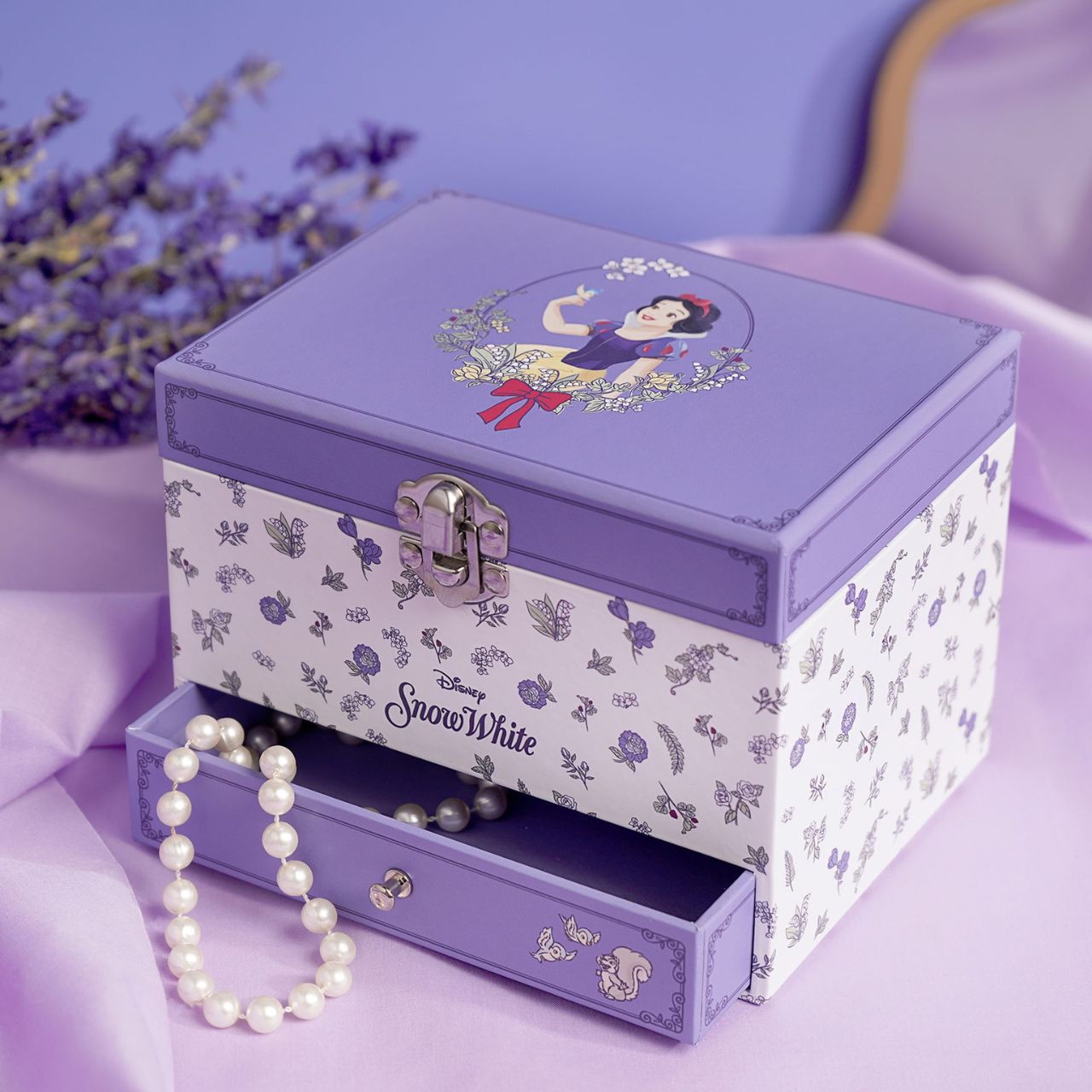 This enchanting jewellery box, adorned with a floral pattern, is a perfect spot for storing treasured trinkets. With a drawer for small keepsakes and a cheery tune that plays when opened, its an ideal gift for Disney princess enthusiasts of all ages.