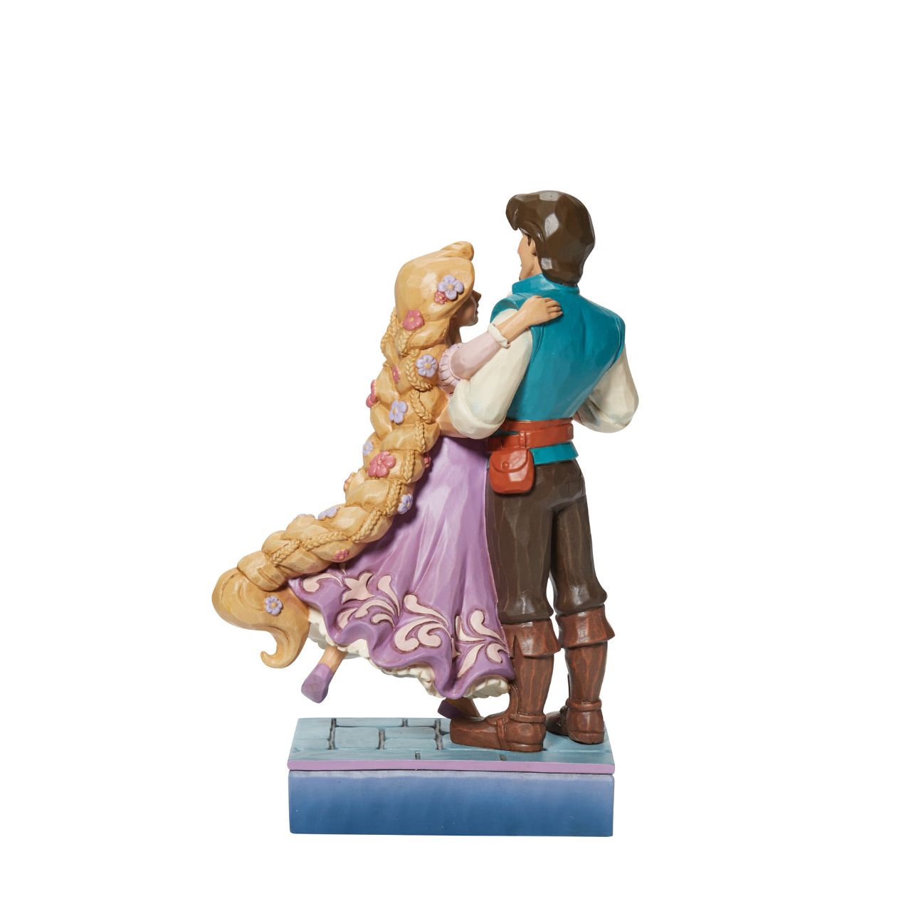 Based on the beloved characters from the 2010 film Tangled, this piece showcases Rapunzel & Flynn Rider happy together. Designed by award winning artist Jim Shore, hand crafted using high quality cast stone and hand painted.