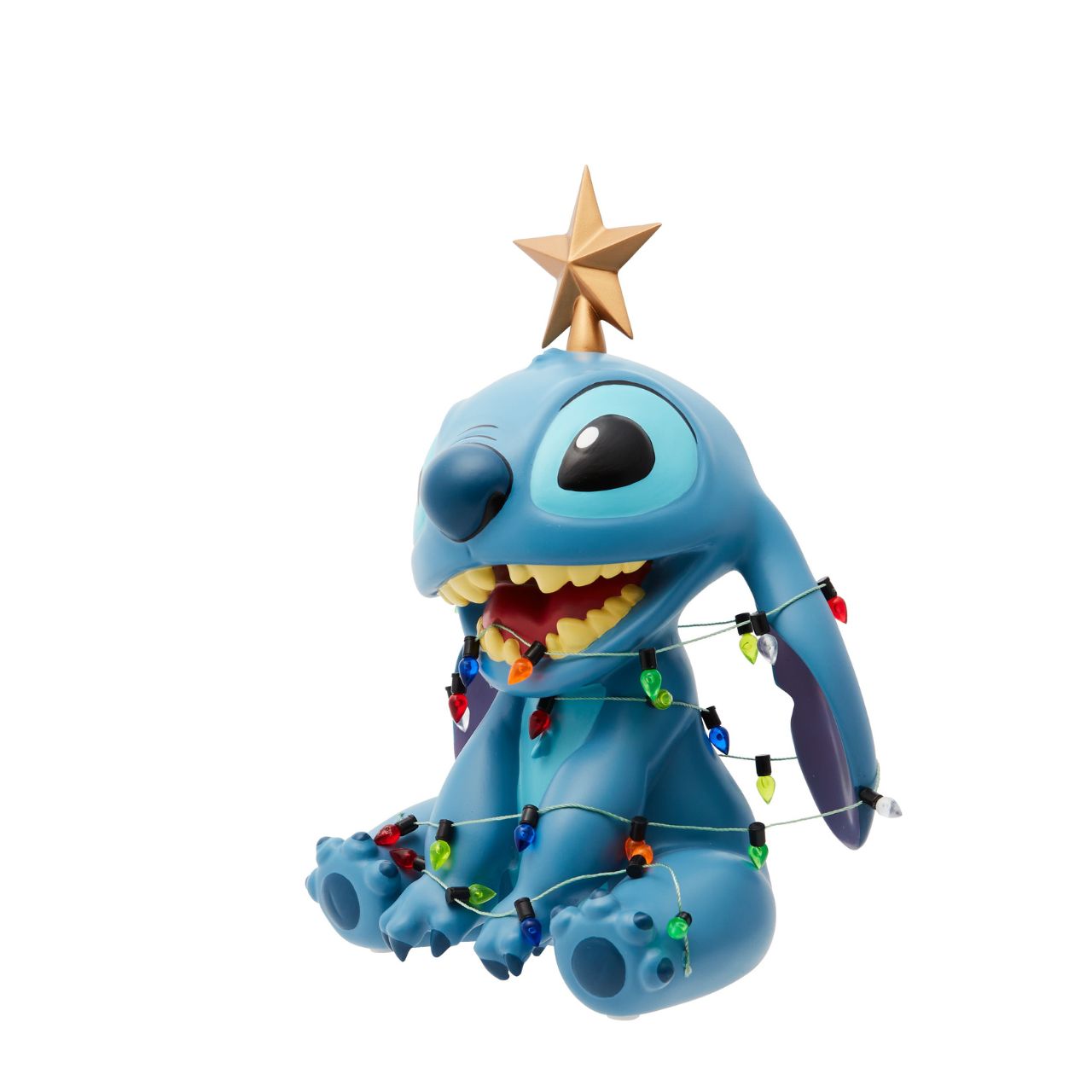 The Christmas Stitch Figurine by Disney Showcase is a fantastic gift for lovers of Disney. Standing 19cm tall with a star on top of his head and a string of Christmas lights around his body, this Stitch figurine is a delightful display piece that will be admired by all those who see it.