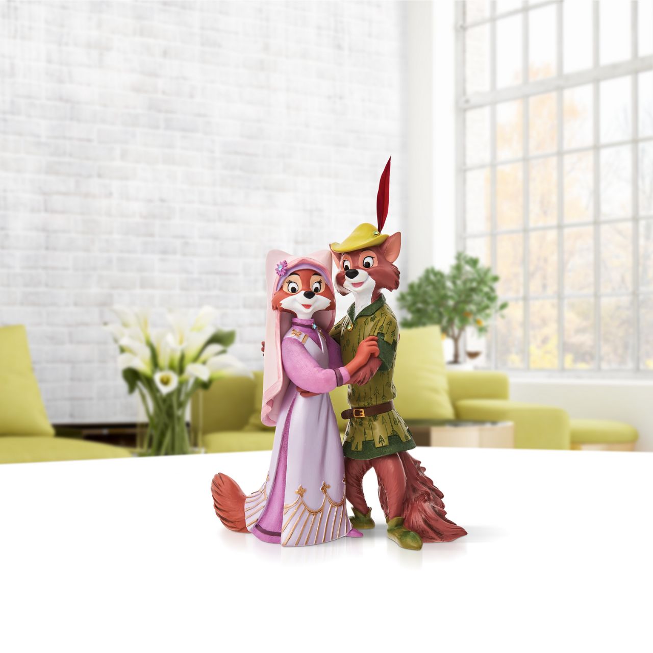 Robin Hood the heroic outlaw is featured here with the beautiful and ladylike Maid Marian in this sweet double figurine. The figurine is made from cast stone. Each piece is hand painted and slight colour variations are to be expected which makes each piece unique.