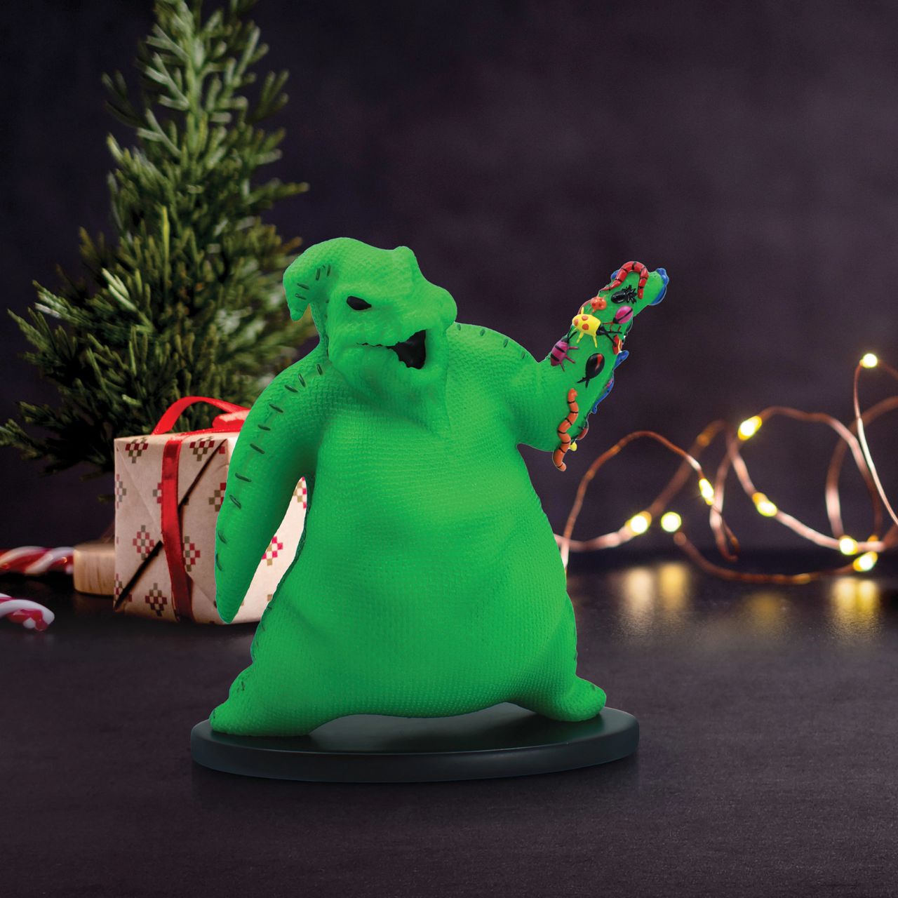Imagine bringing home a piece of haunting magic with this Oogie Boogie glow-in-the-dark figurine. Every night will be full of delightful frights as Oogie Boogie, will let his ghostly glow add a touch of Halloween magic to your everyday.