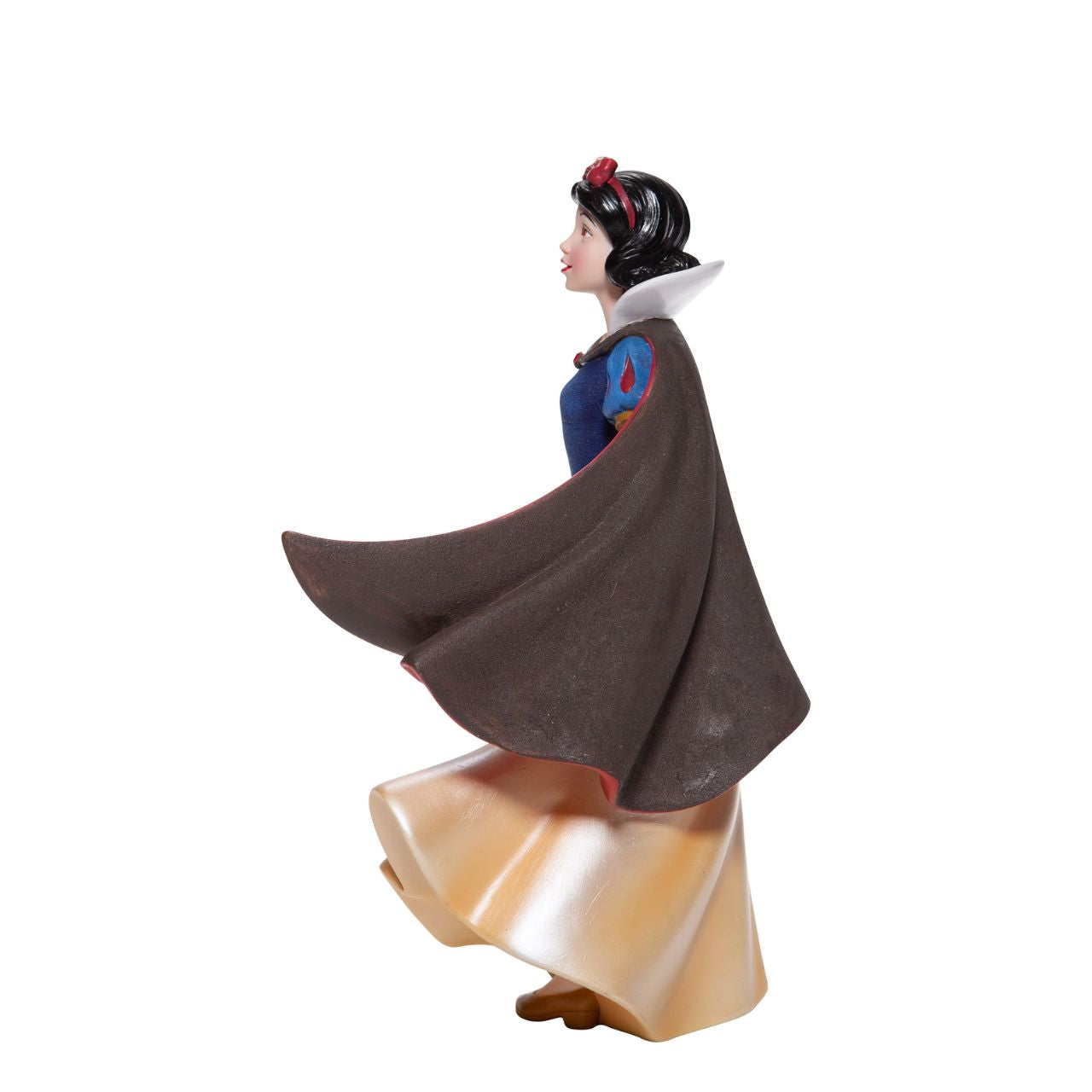 Snow White Couture de Force Figurine Snow White with her skin fair as snow and lips red as apples follows the wind on a new adventure fit for a princess. Hand-crafted and hand-painted, her iconic outfit shimmers in yellow satins and dark wool felts plussed with red faux gem stones.