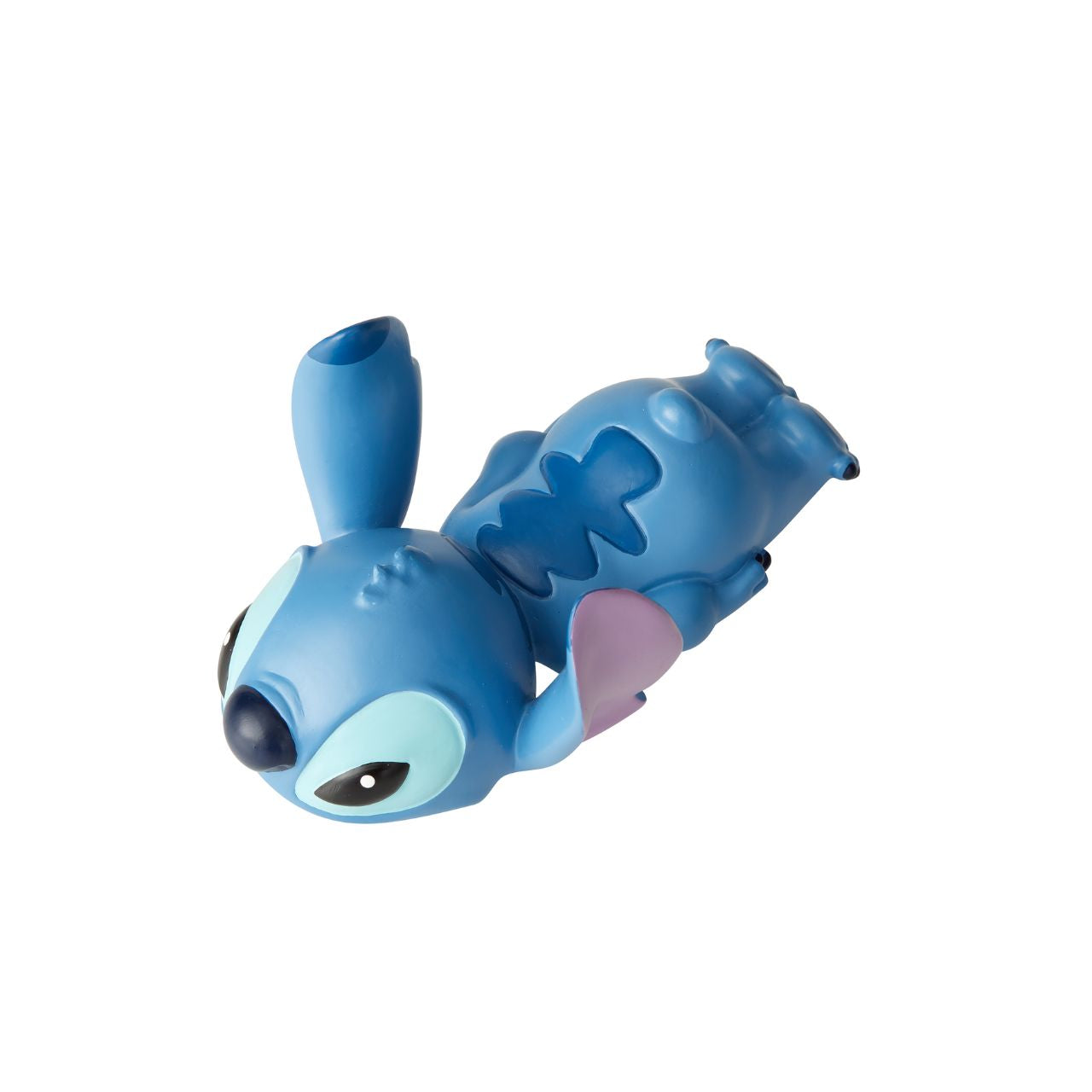 Stitch Laying Down Figurine by Disney Showcase Stubborn Stitch is still as cute as ever, and this little guy can't help but make you smile. Cute, clever and charismatic, Stitch's fun-loving nature is just what you need to brighten your day.