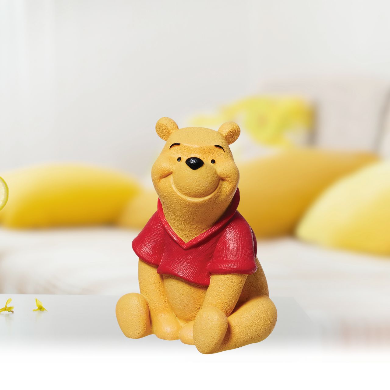 One of Disney's most beloved characters Winne the Pooh sits in an adorable pose. with incredible detail on Winnie the Pooh's shirt this is finished in a linen texture whilst his body has a velvetine texture. The perfect nursery décor.