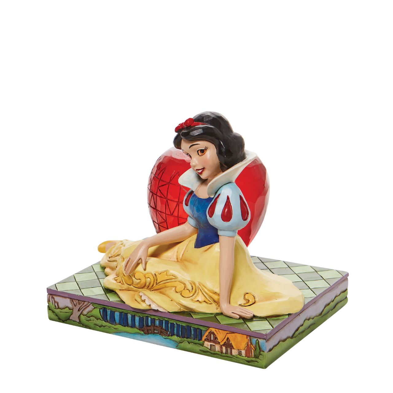 Jim Shore Disney Snow White with Apple Figurine  This Disney Traditions line by Jim Shore features iconic Walt Disney princesses with their famous props. With a base illustrating her story, this piece features Snow White in her famous gown next to a large apple.