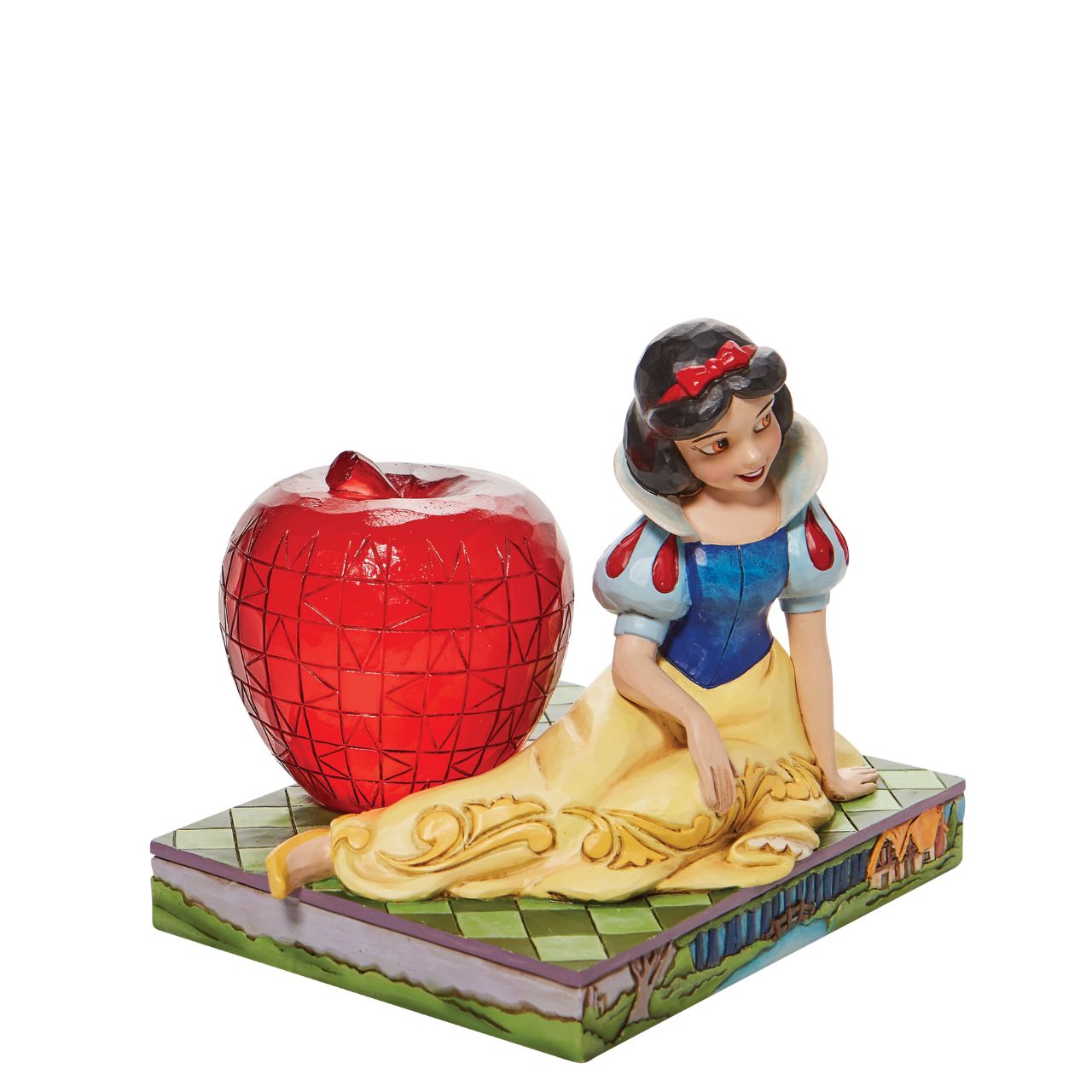 Jim Shore Disney Snow White with Apple Figurine  This Disney Traditions line by Jim Shore features iconic Walt Disney princesses with their famous props. With a base illustrating her story, this piece features Snow White in her famous gown next to a large apple.
